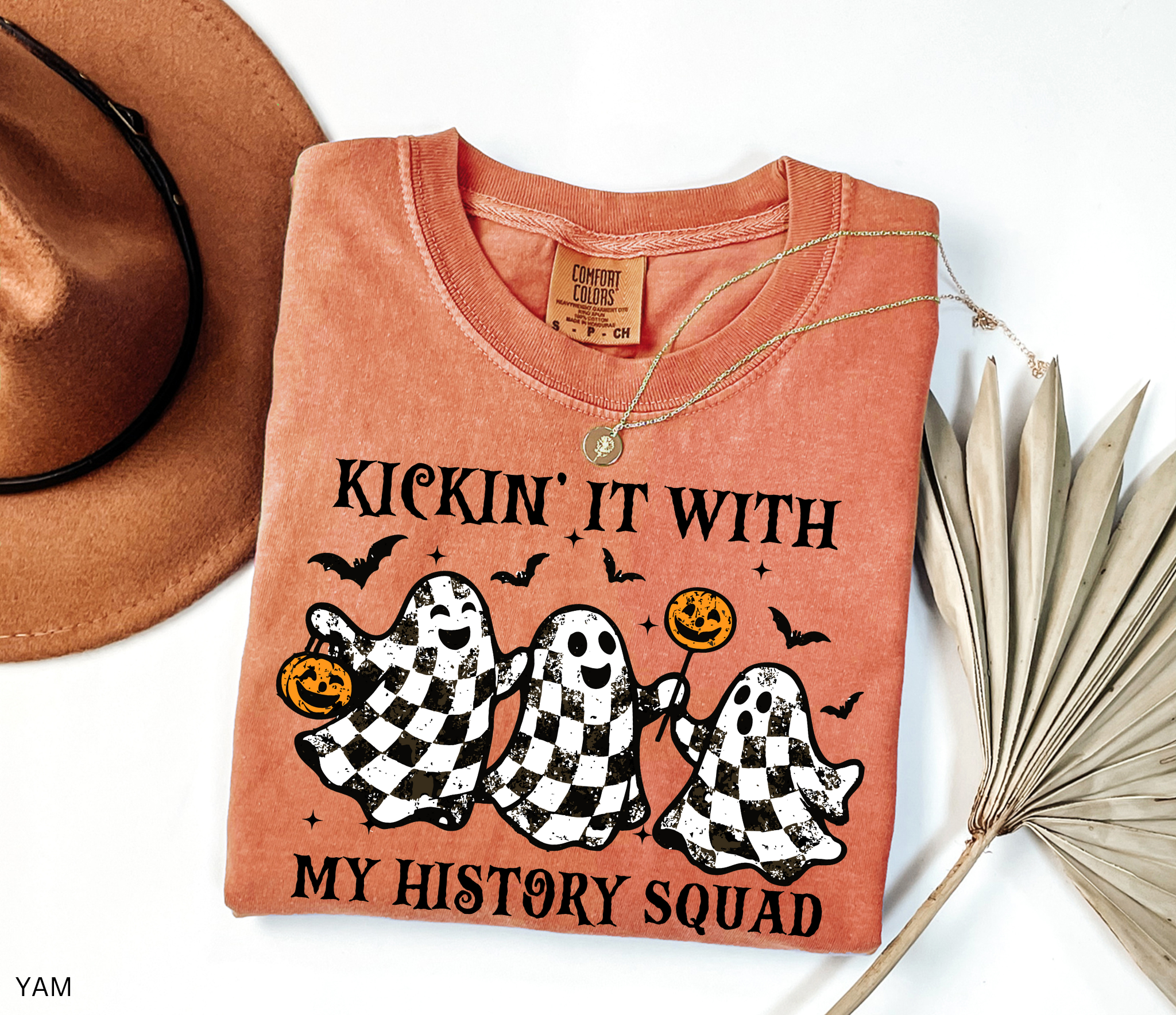 Halloween history teacher shirt with distressed checkered ghosts holding pumpkins and candy, surrounded by bats. Funny and spooky teacher design.