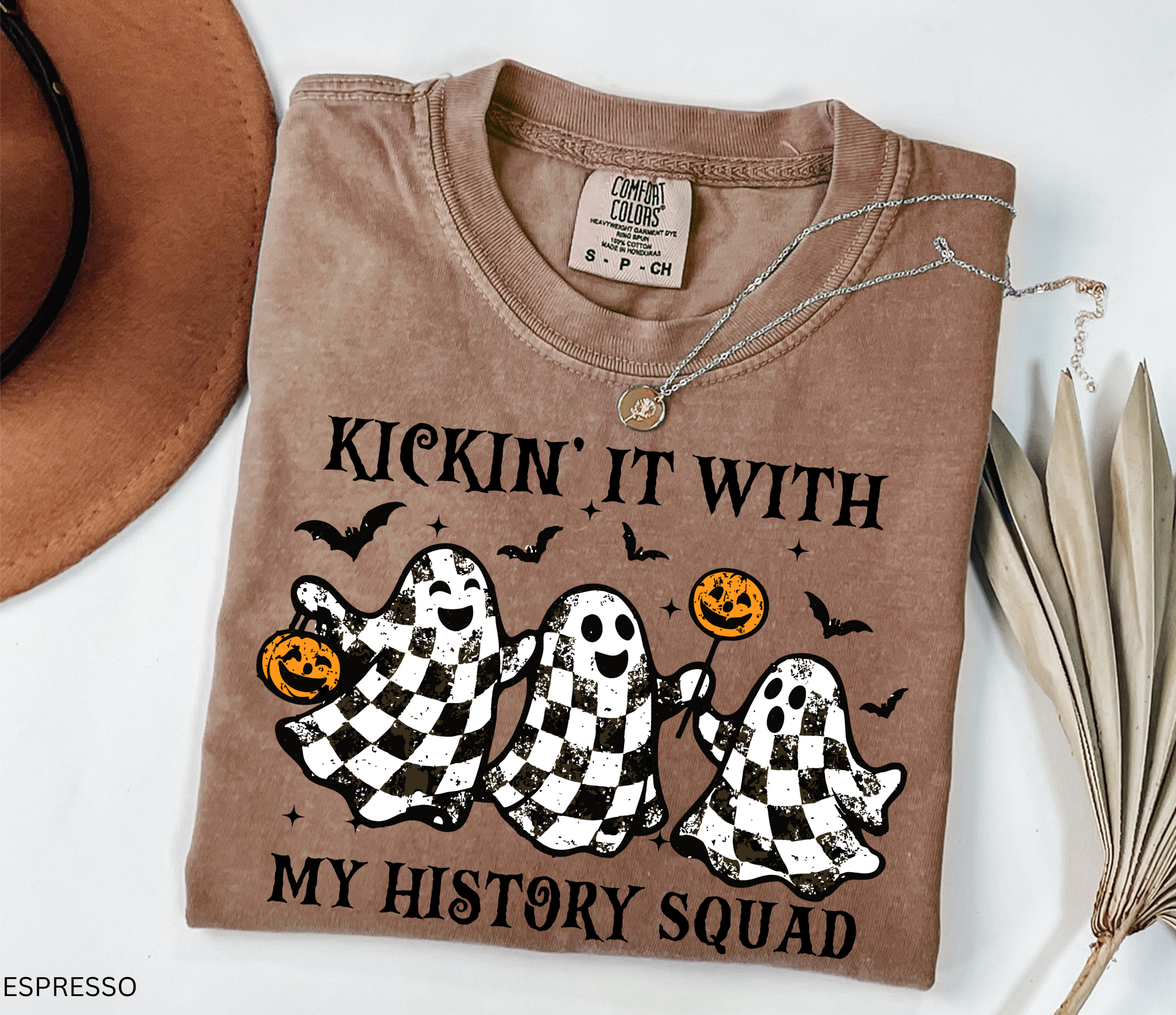 Halloween history teacher shirt with distressed checkered ghosts holding pumpkins and candy, surrounded by bats. Funny and spooky teacher design.