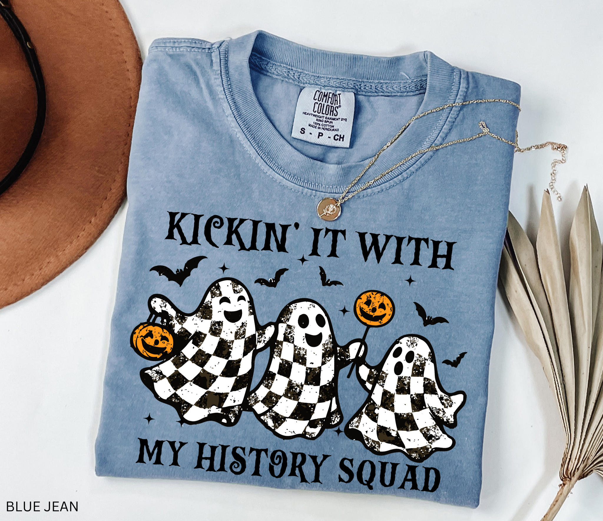 Halloween history teacher shirt with distressed checkered ghosts holding pumpkins and candy, surrounded by bats. Funny and spooky teacher design.