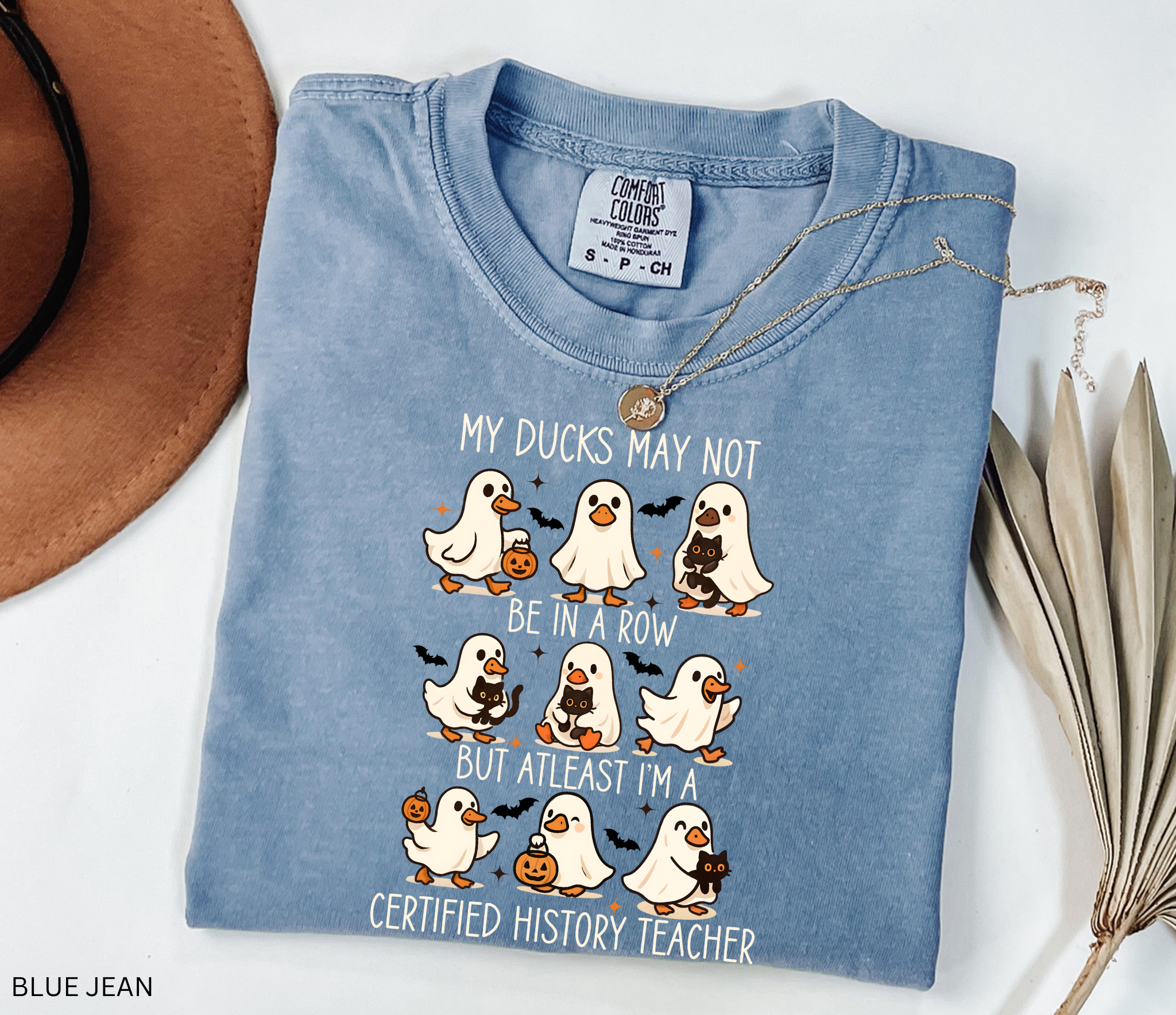 Halloween shirt design with ghost ducks carrying pumpkins and black cats, paired with the phrase “certified history teacher.”