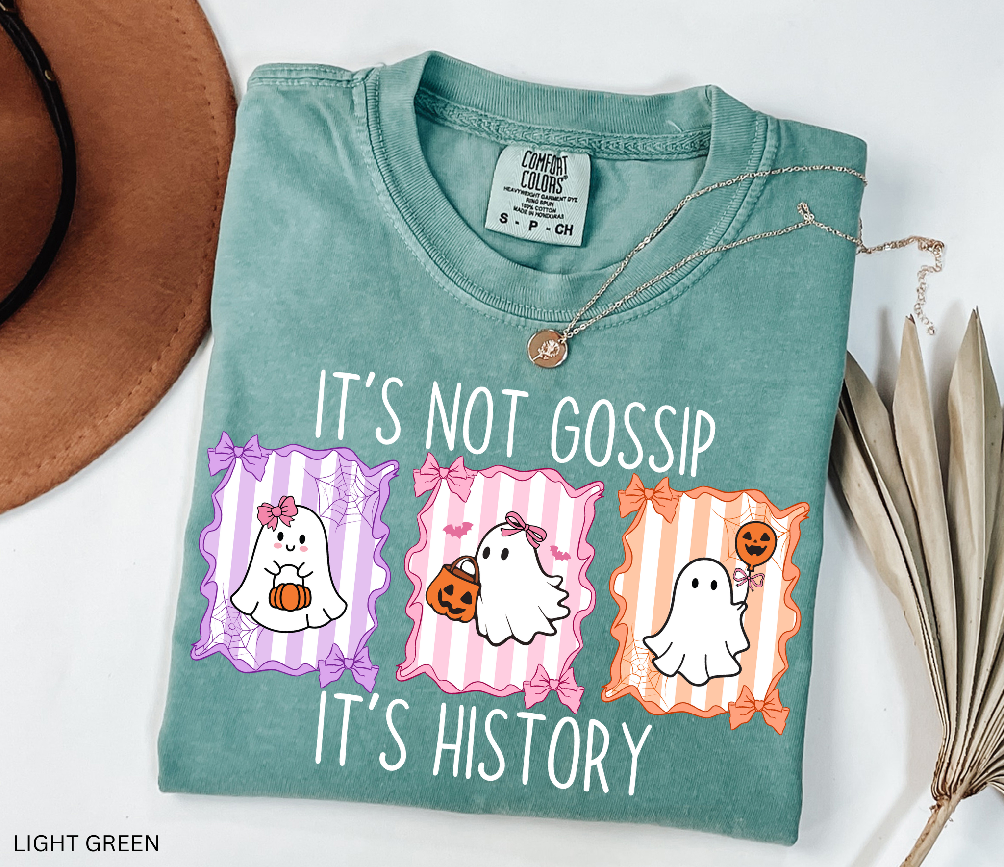 Halloween ghost shirt with three pastel ghosts in bows, pumpkins, spiderweb frames, and the phrase “It’s Not Gossip, It’s History” for history teachers/professors.