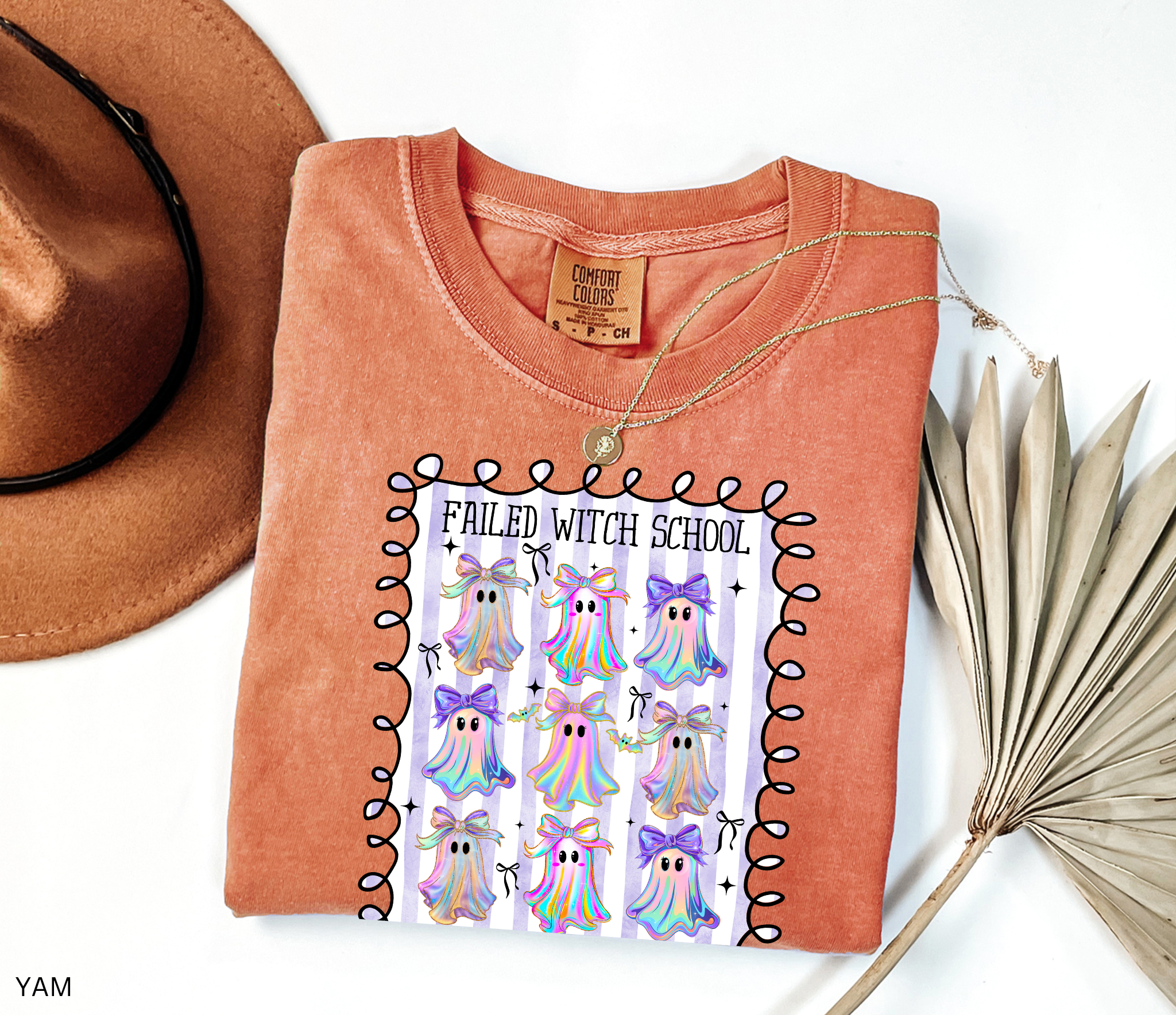 Daycare teacher Halloween shirt with colorful rainbow ghosts and bows, featuring the phrase “Failed Witch School, Now I Care for Tiny Boos.” Funny Halloween tee for childcare workers.