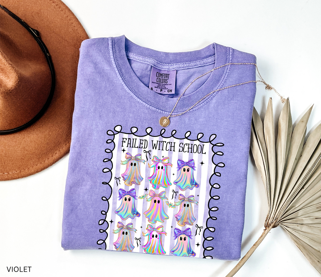 Daycare teacher Halloween shirt with colorful rainbow ghosts and bows, featuring the phrase “Failed Witch School, Now I Care for Tiny Boos.” Funny Halloween tee for childcare workers.