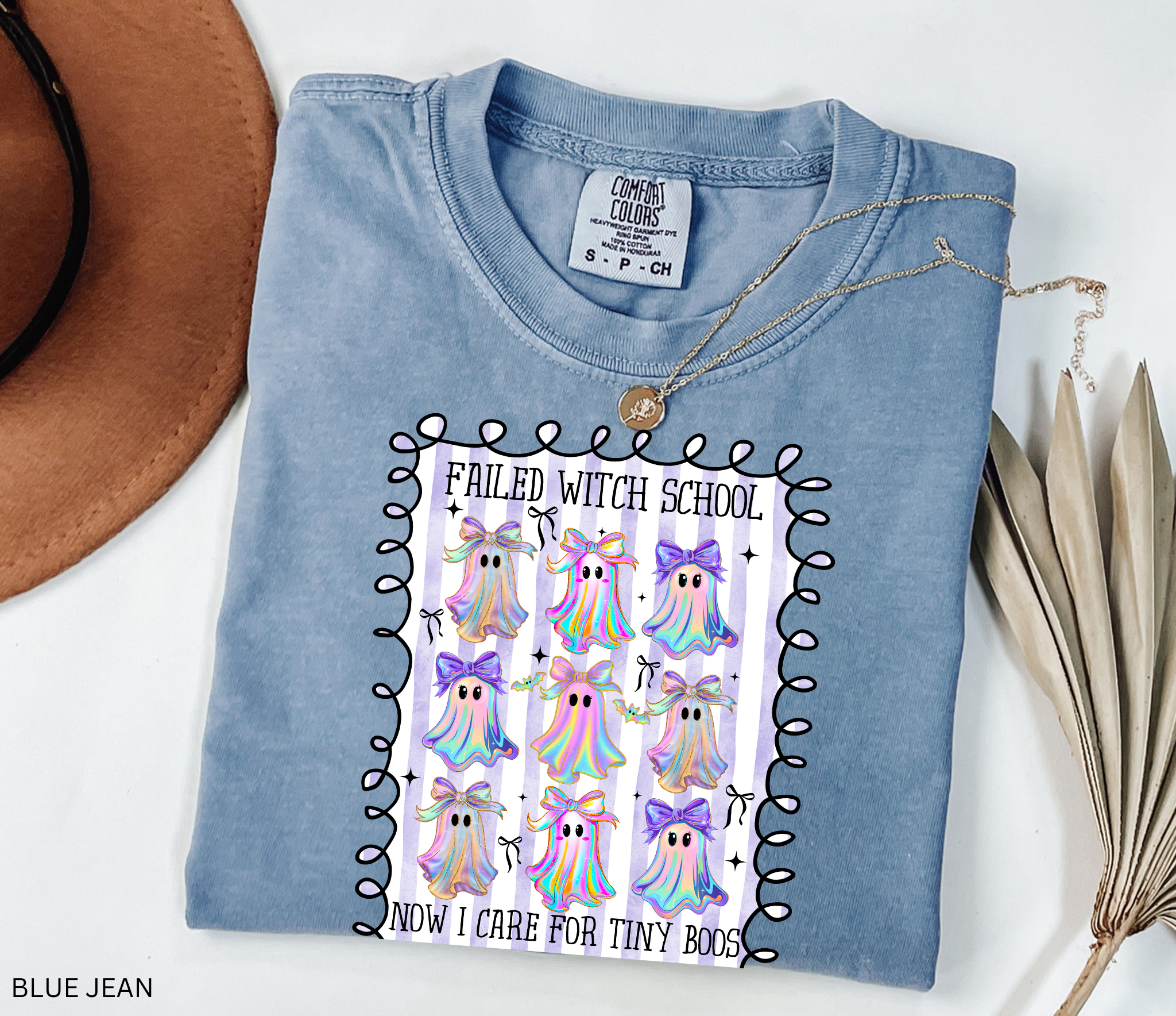 Daycare teacher Halloween shirt with colorful rainbow ghosts and bows, featuring the phrase “Failed Witch School, Now I Care for Tiny Boos.” Funny Halloween tee for childcare workers.