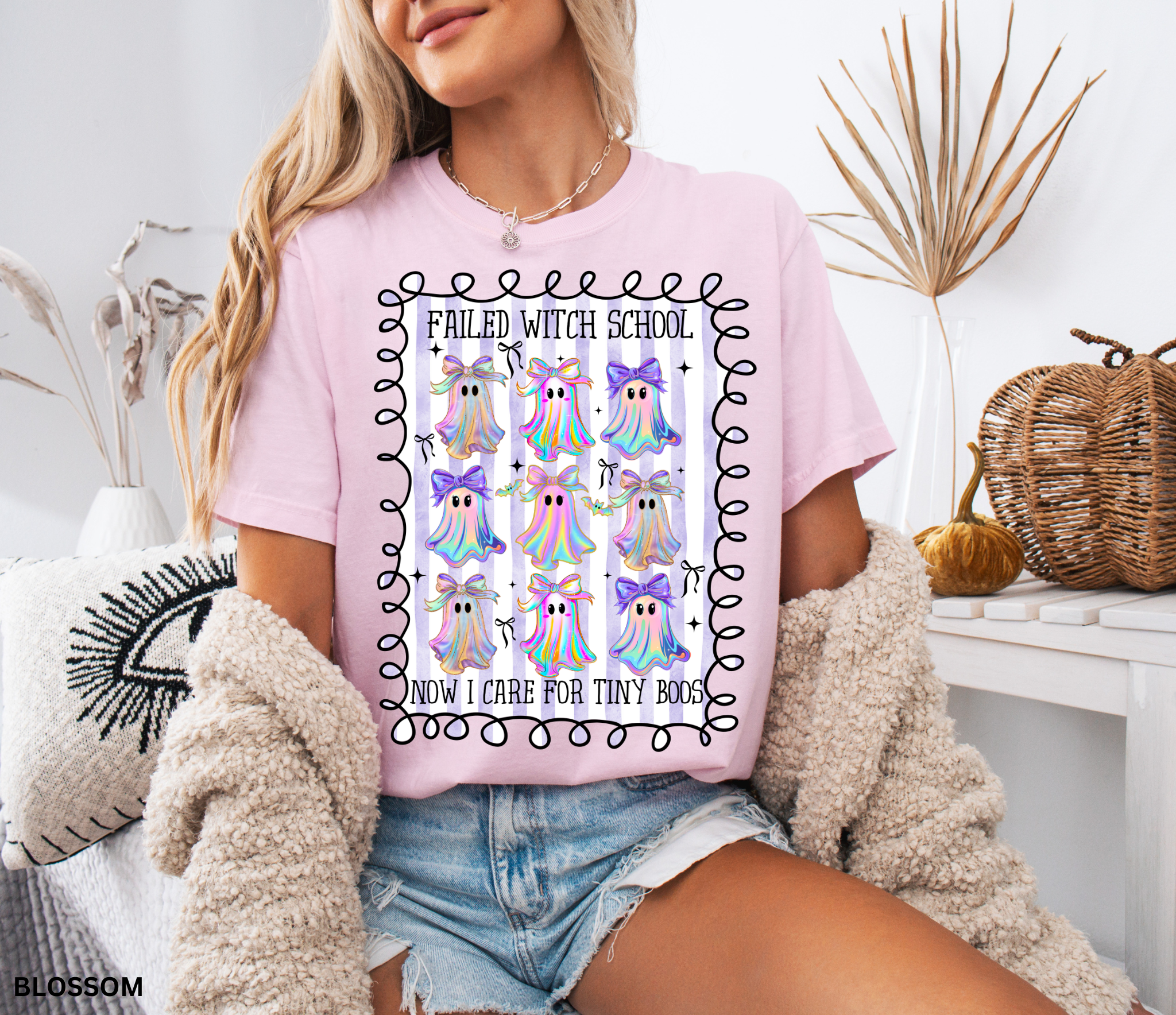 Daycare teacher Halloween shirt with colorful rainbow ghosts and bows, featuring the phrase “Failed Witch School, Now I Care for Tiny Boos.” Funny Halloween tee for childcare workers.