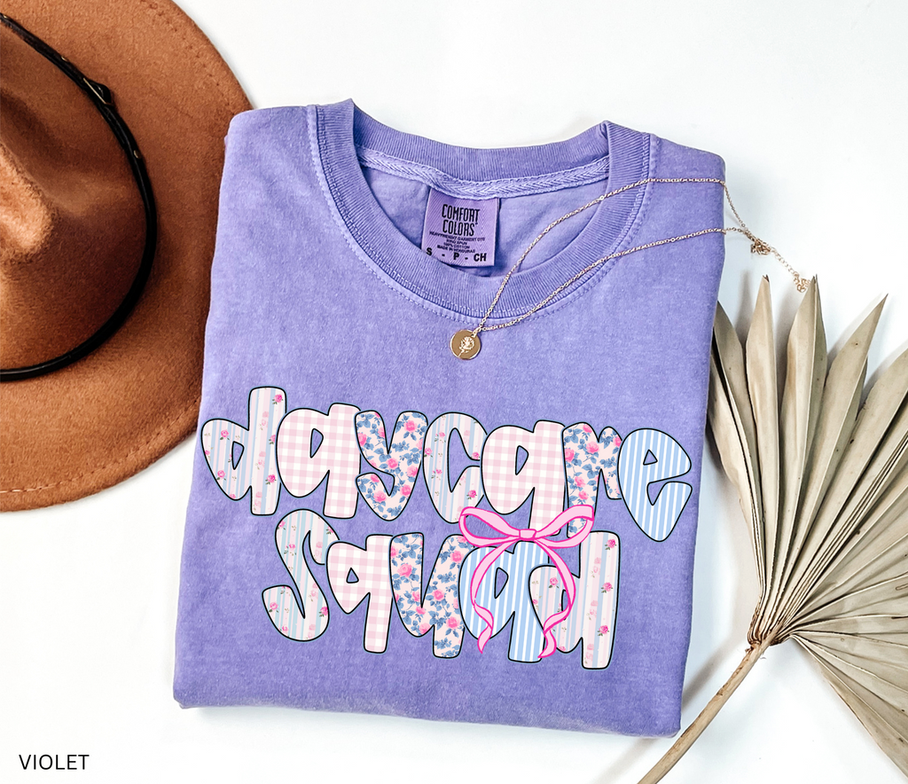 Daycare Squad shirt with floral patterns and pink bow design – teacher team apparel