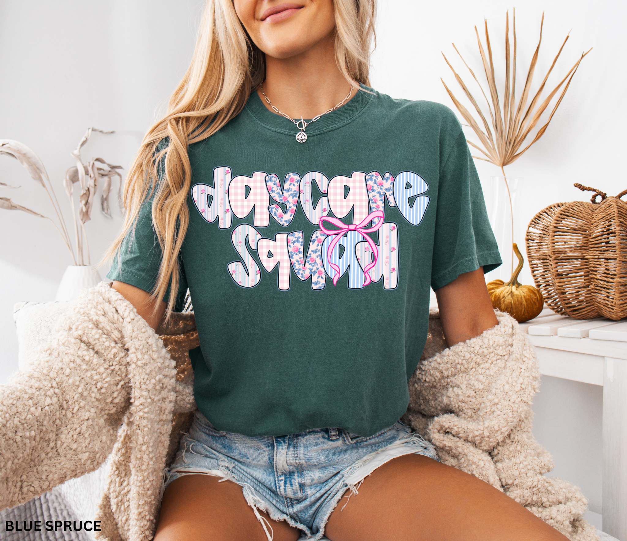 Daycare Squad shirt with floral patterns and pink bow design – teacher team apparel