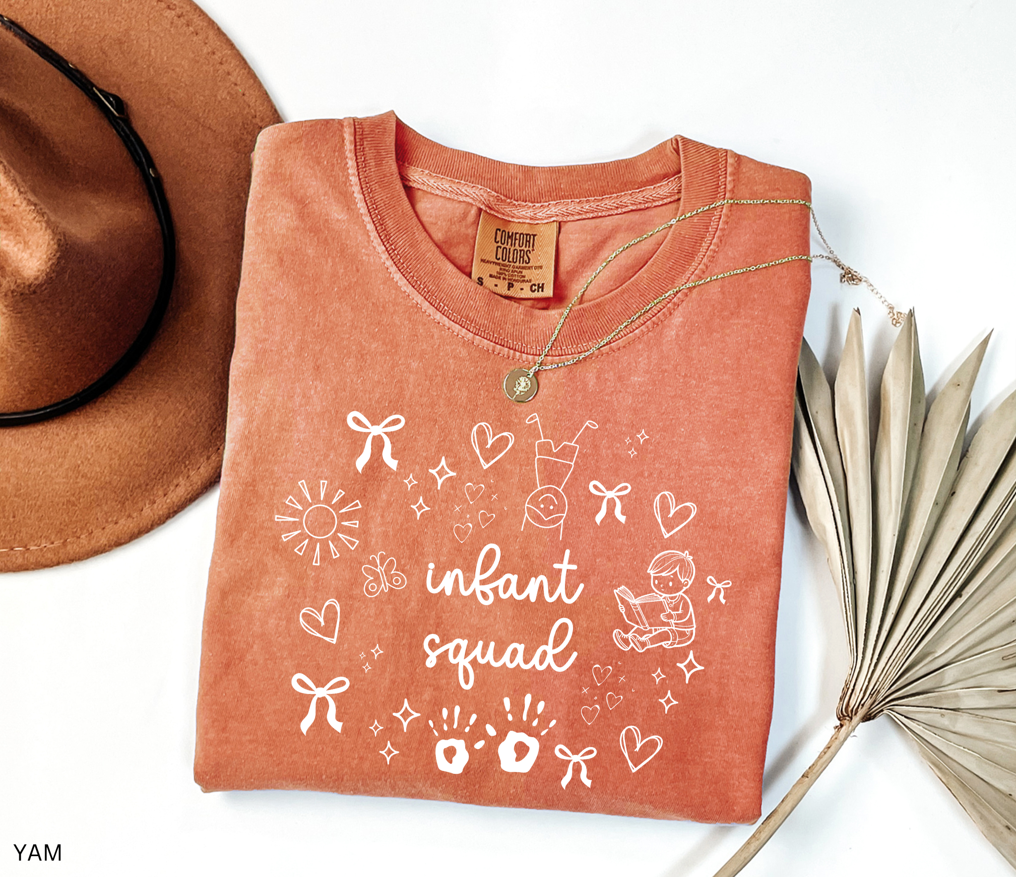 White doodle-style design with bows, hearts, stars, sunshine, baby handprints, a reading child, and the words “Infant Squad.”