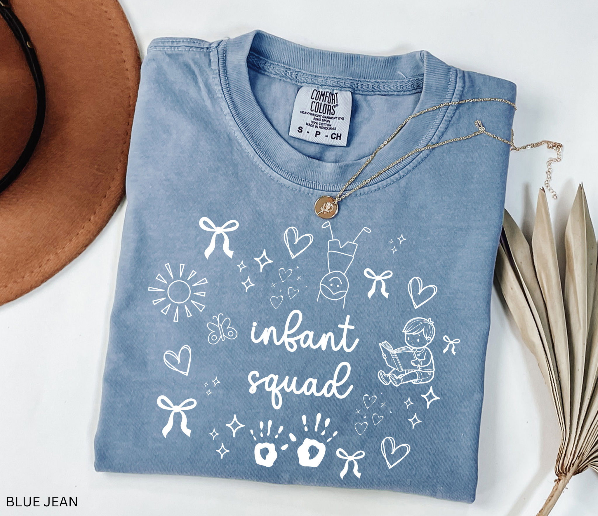 White doodle-style design with bows, hearts, stars, sunshine, baby handprints, a reading child, and the words “Infant Squad.”