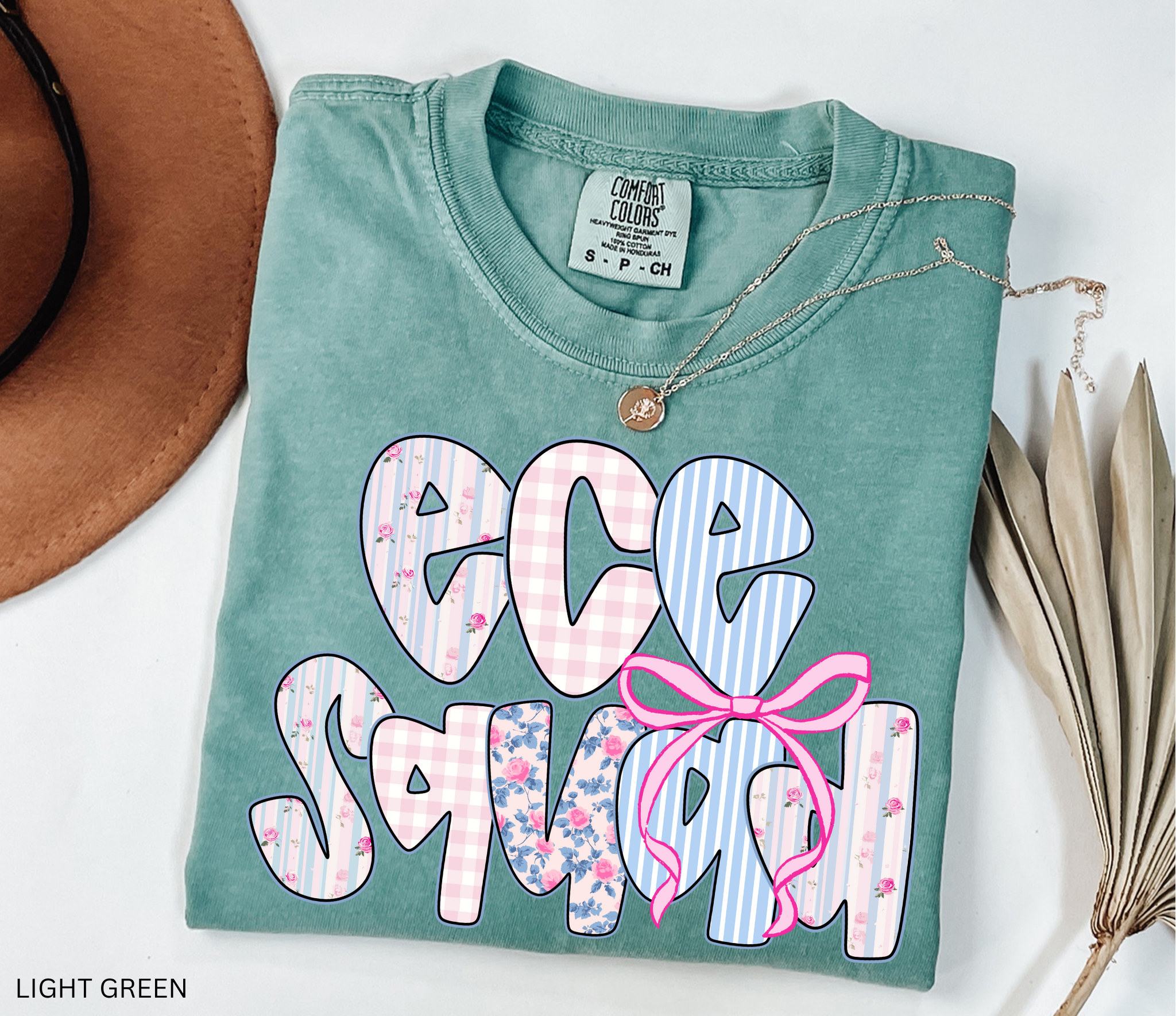 Bold “ECE Squad” text with floral, gingham, and striped patterns, decorated with a pink bow.