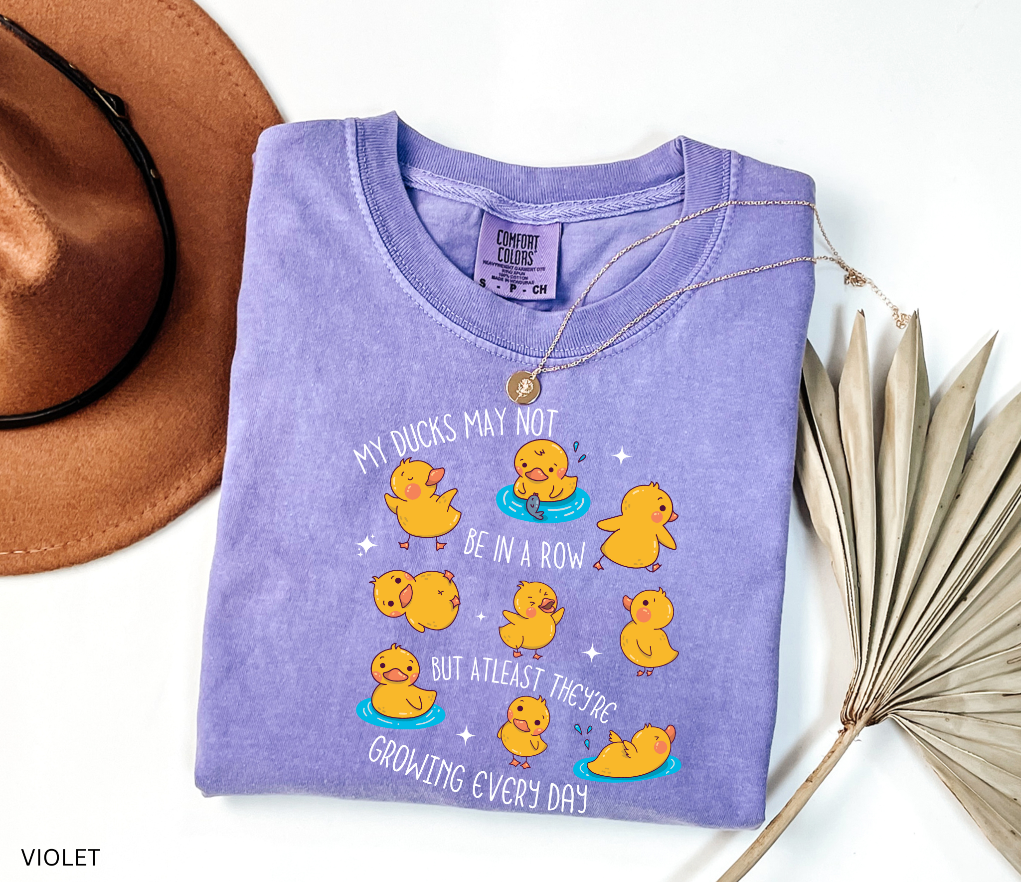 Daycare teacher shirt with cartoon ducklings and the phrase My ducks may not be in a row but at least they’re growing every day