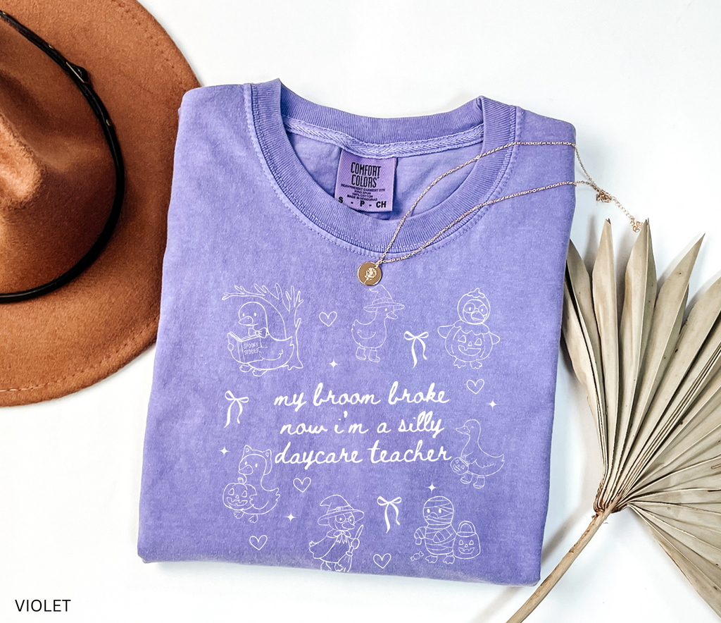 Halloween daycare teacher shirt with geese in witch, pumpkin, and mummy costumes with text saying My Broom Broke, Now I’m a Silly Daycare Teacher.