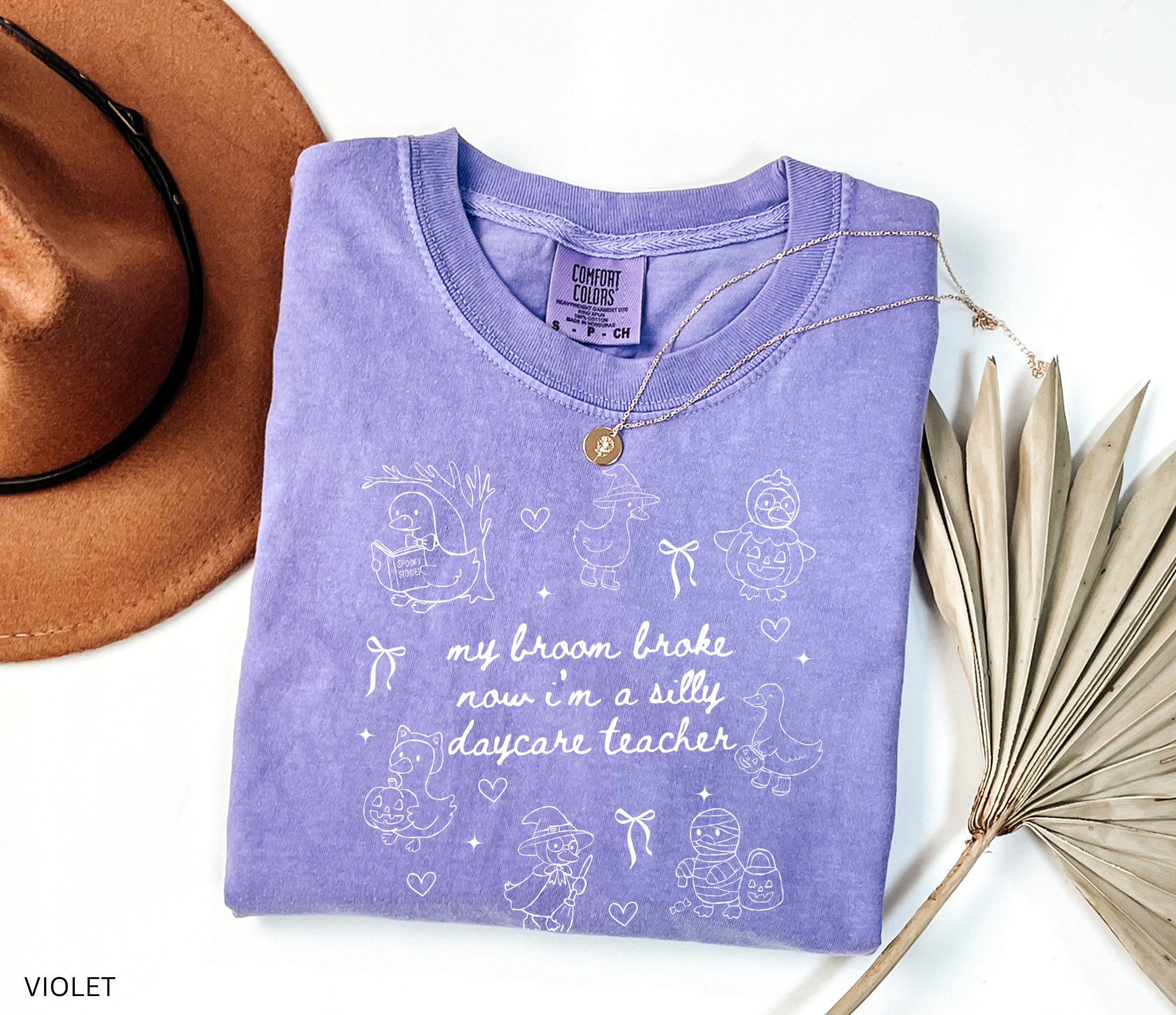 Halloween daycare teacher shirt with geese in witch, pumpkin, and mummy costumes with text saying My Broom Broke, Now I’m a Silly Daycare Teacher.