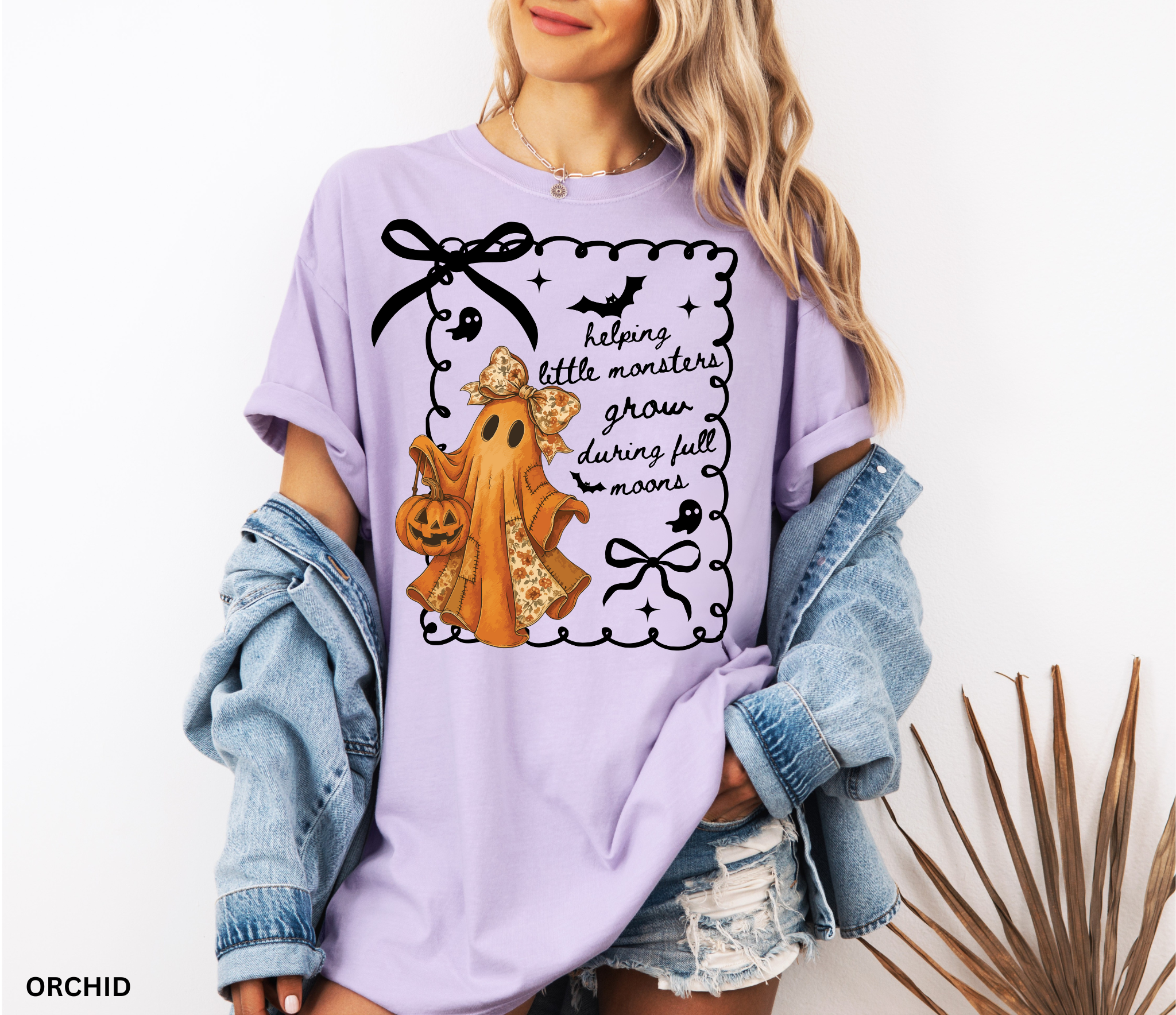 Halloween daycare teacher shirt with an orange patchwork ghost wearing a floral bow, holding a jack-o’-lantern pumpkin bucket.