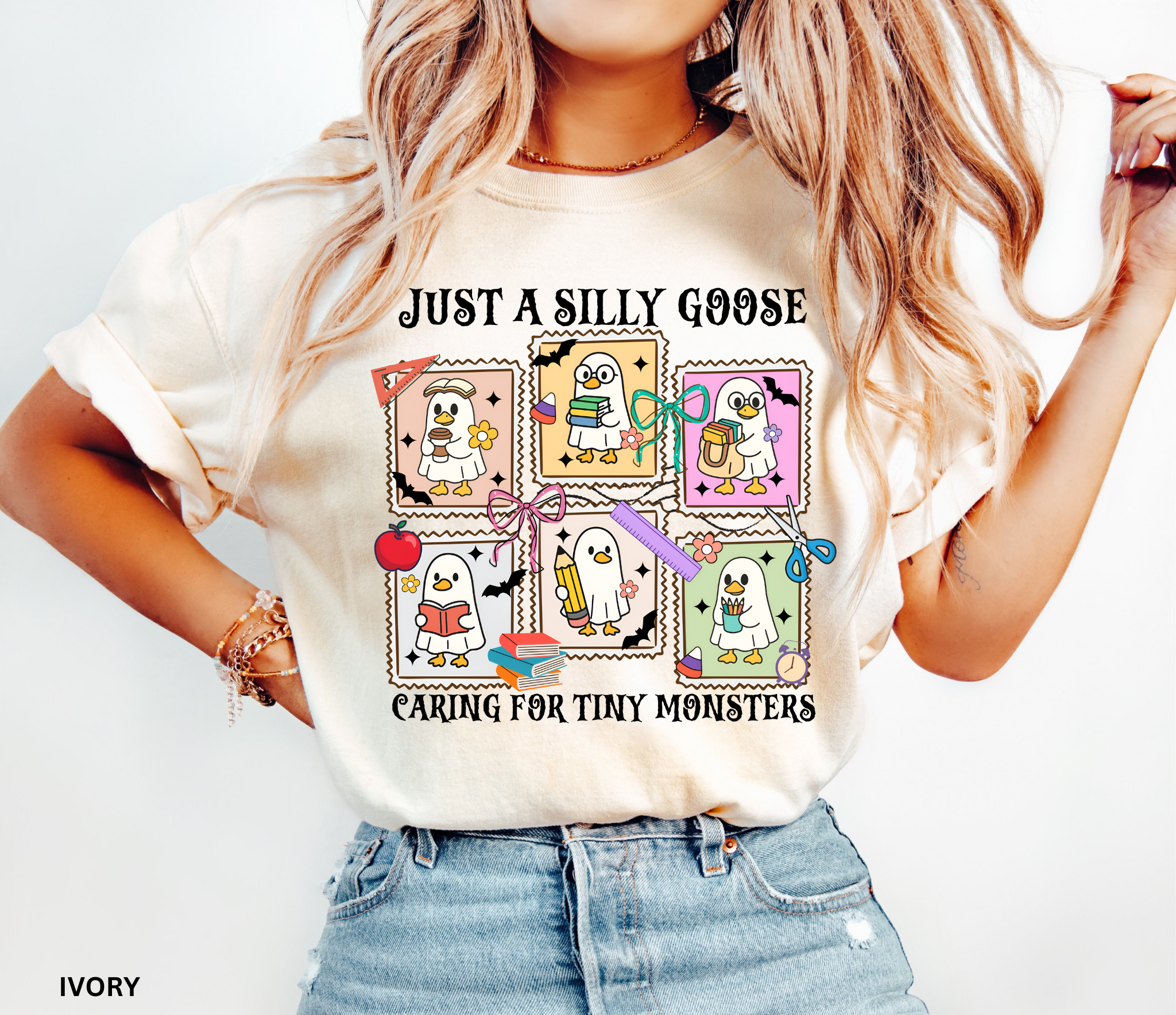 Halloween daycare teacher shirt featuring six cartoon geese in ghost costumes holding books, pencils, and coffee with the phrase “Just a Silly Goose Caring for Tiny Monsters.”
