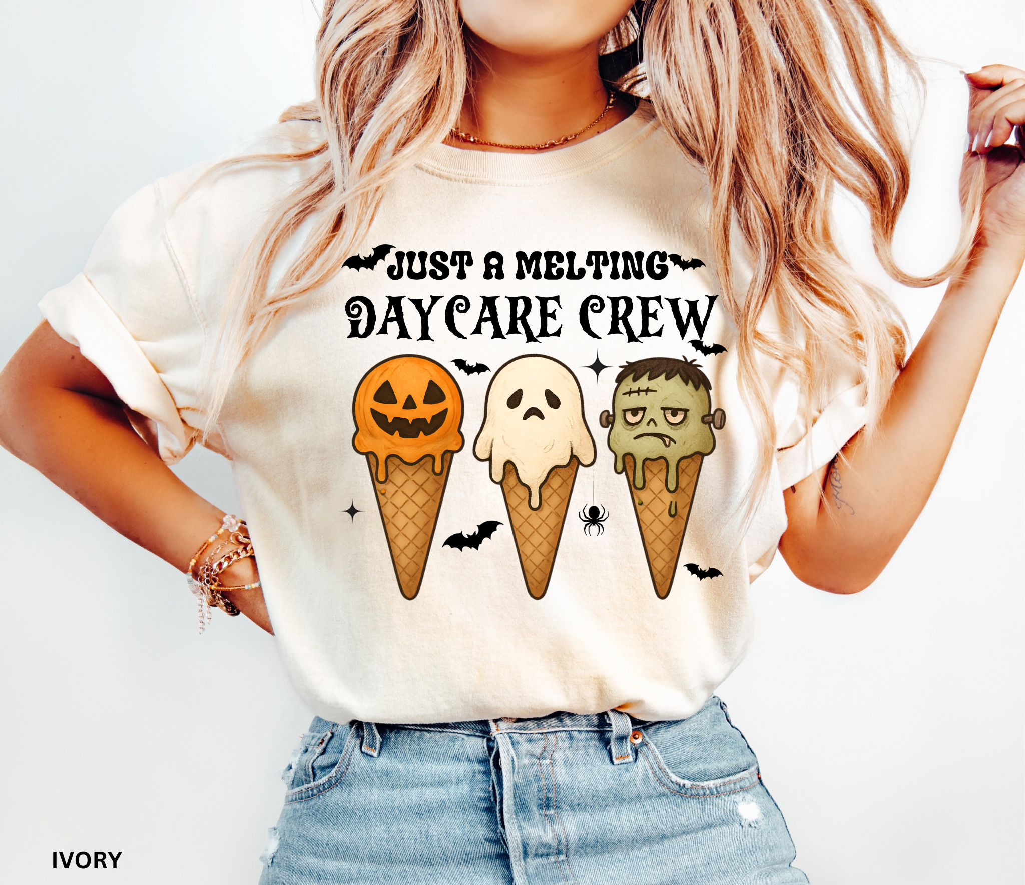Daycare teacher Halloween shirt with three ice cream cones designed as a pumpkin, ghost, and Frankenstein monster, with the phrase “Just a Melting Daycare Crew.”