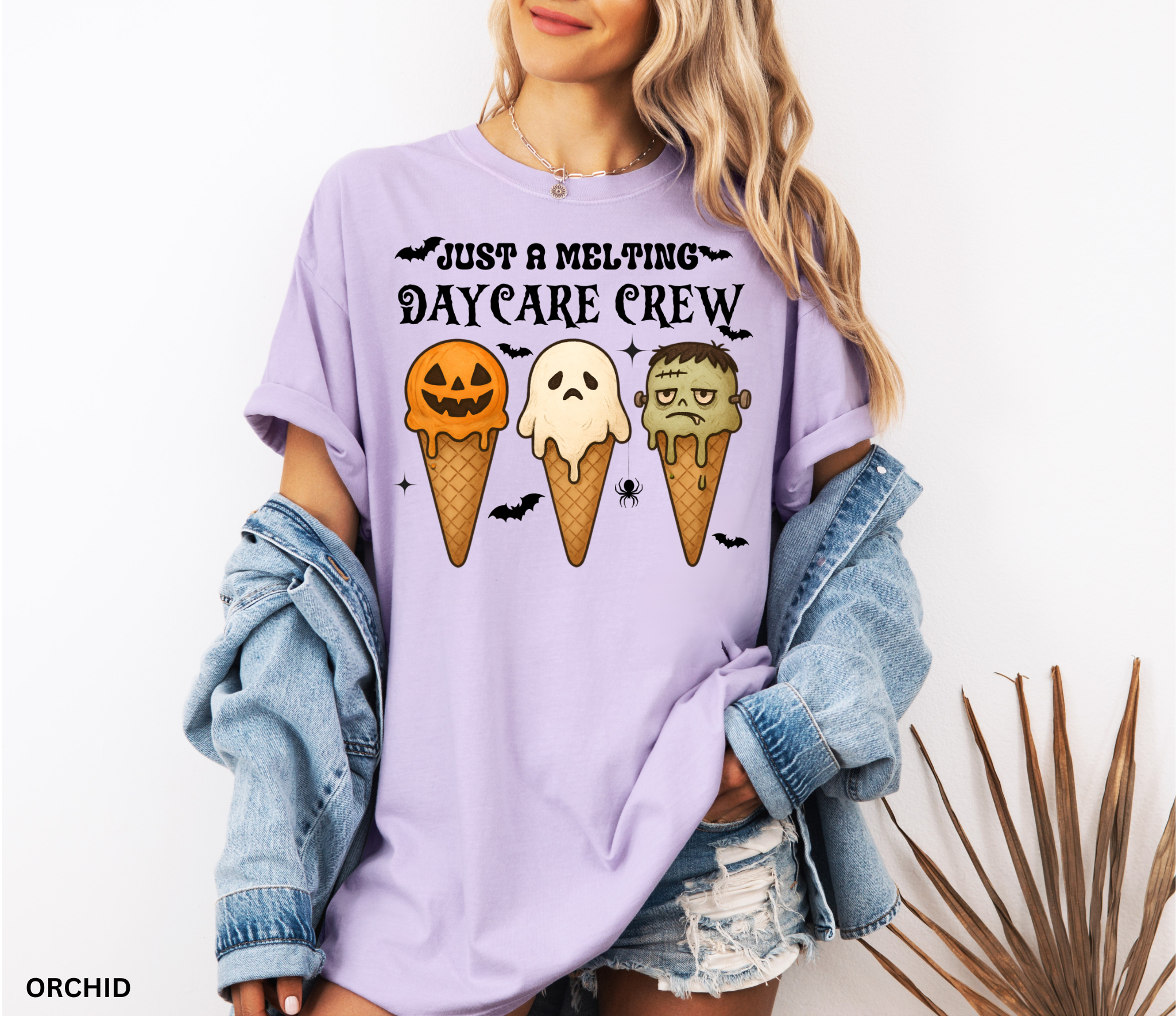 Daycare teacher Halloween shirt with three ice cream cones designed as a pumpkin, ghost, and Frankenstein monster, with the phrase “Just a Melting Daycare Crew.”
