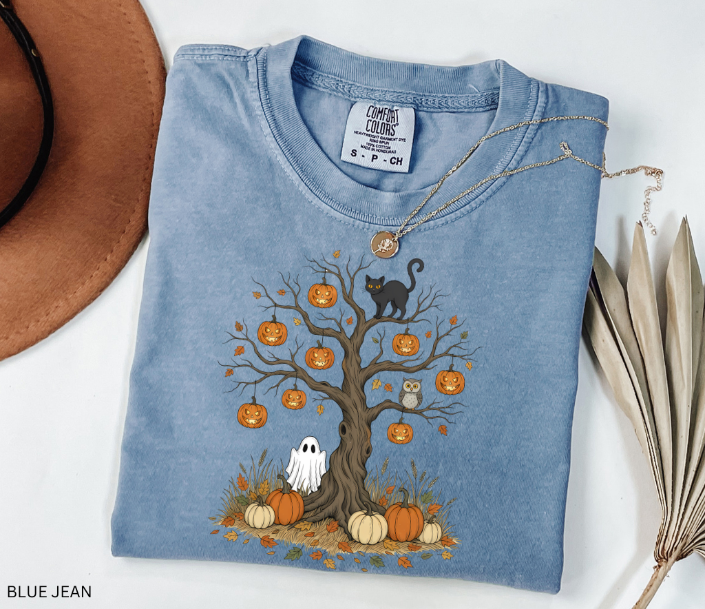 Halloween tree design with jack-o’-lanterns, black cat, ghost, owl, and pumpkins surrounded by autumn leaves – spooky Halloween shirt artwork