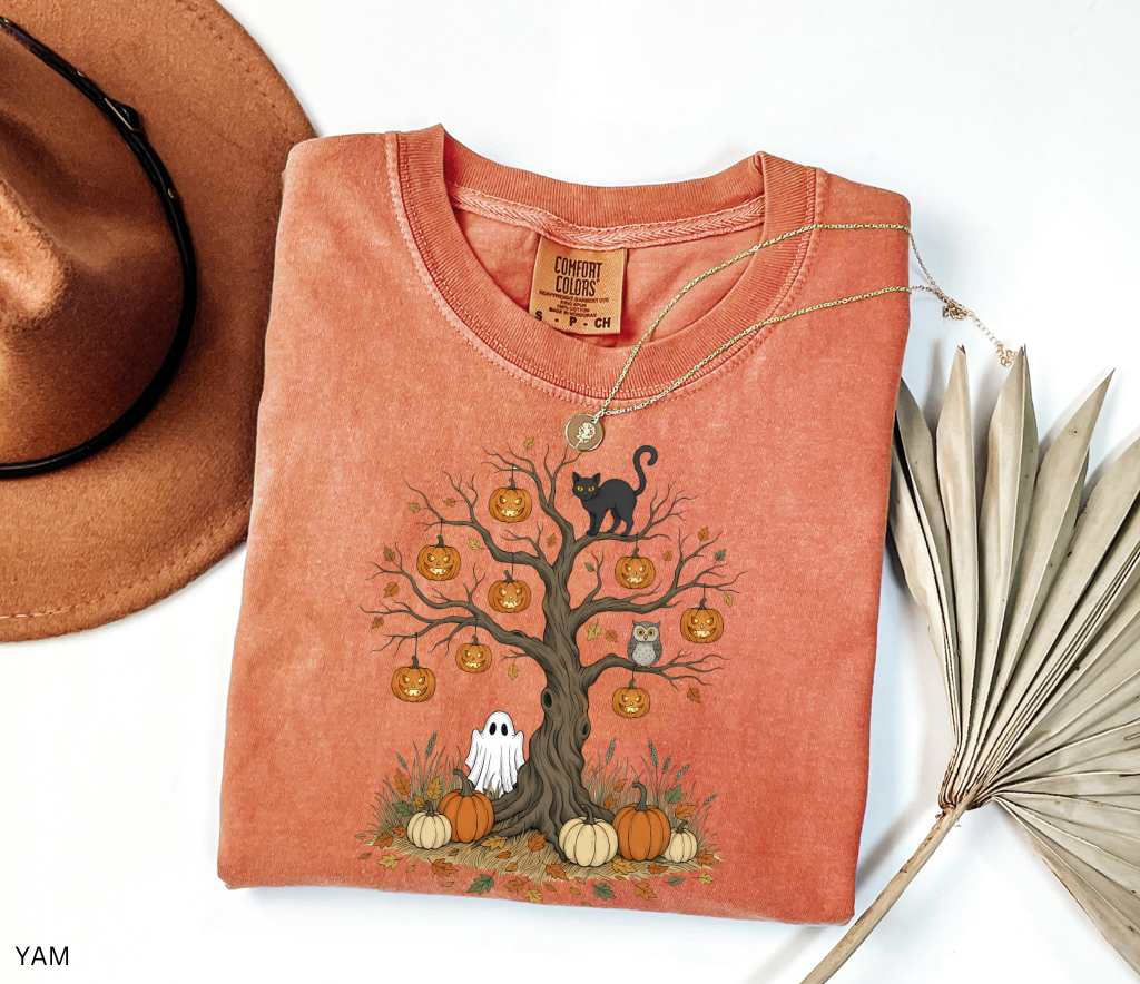 Halloween tree design with jack-o’-lanterns, black cat, ghost, owl, and pumpkins surrounded by autumn leaves – spooky Halloween shirt artwork