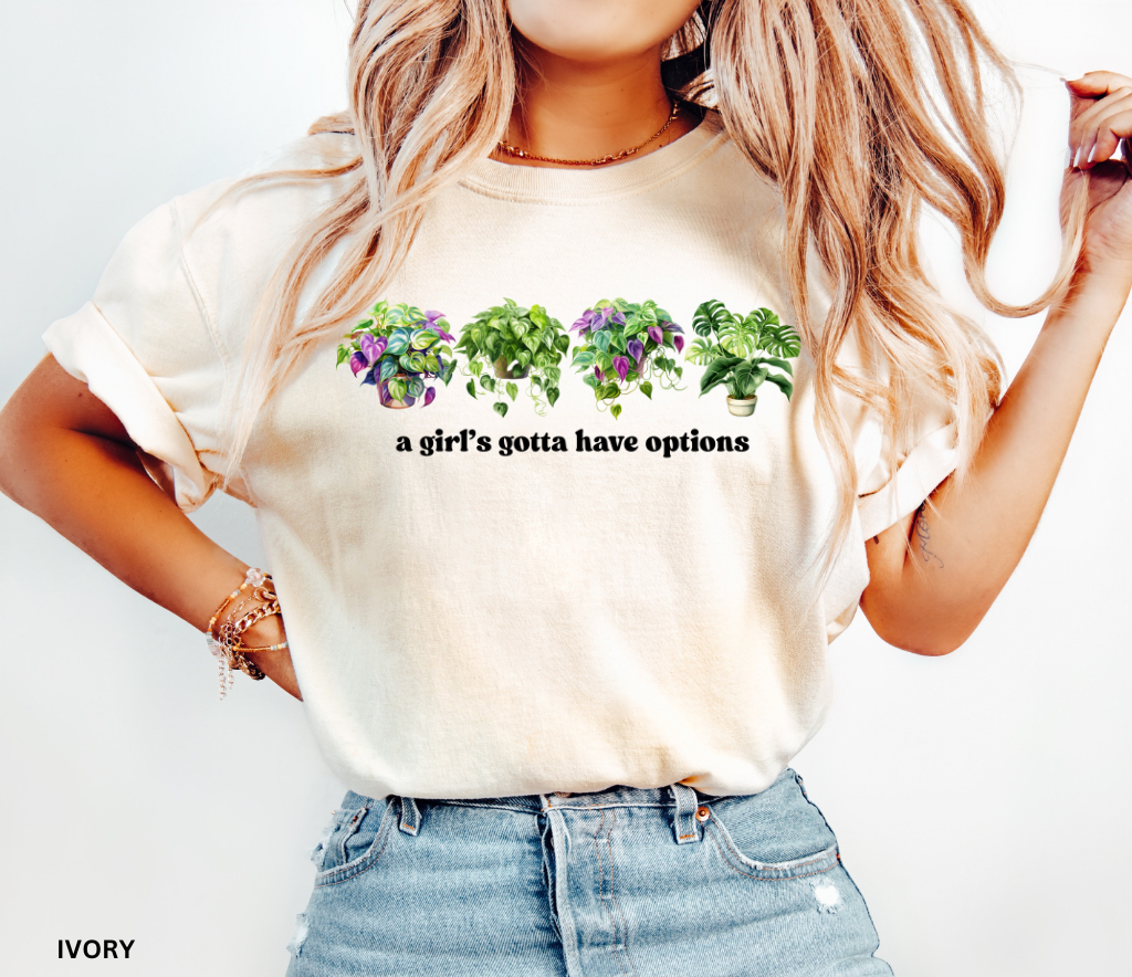 Funny plant shirt with four colorful houseplants and text “a girl’s gotta have options” – gift for plant lovers