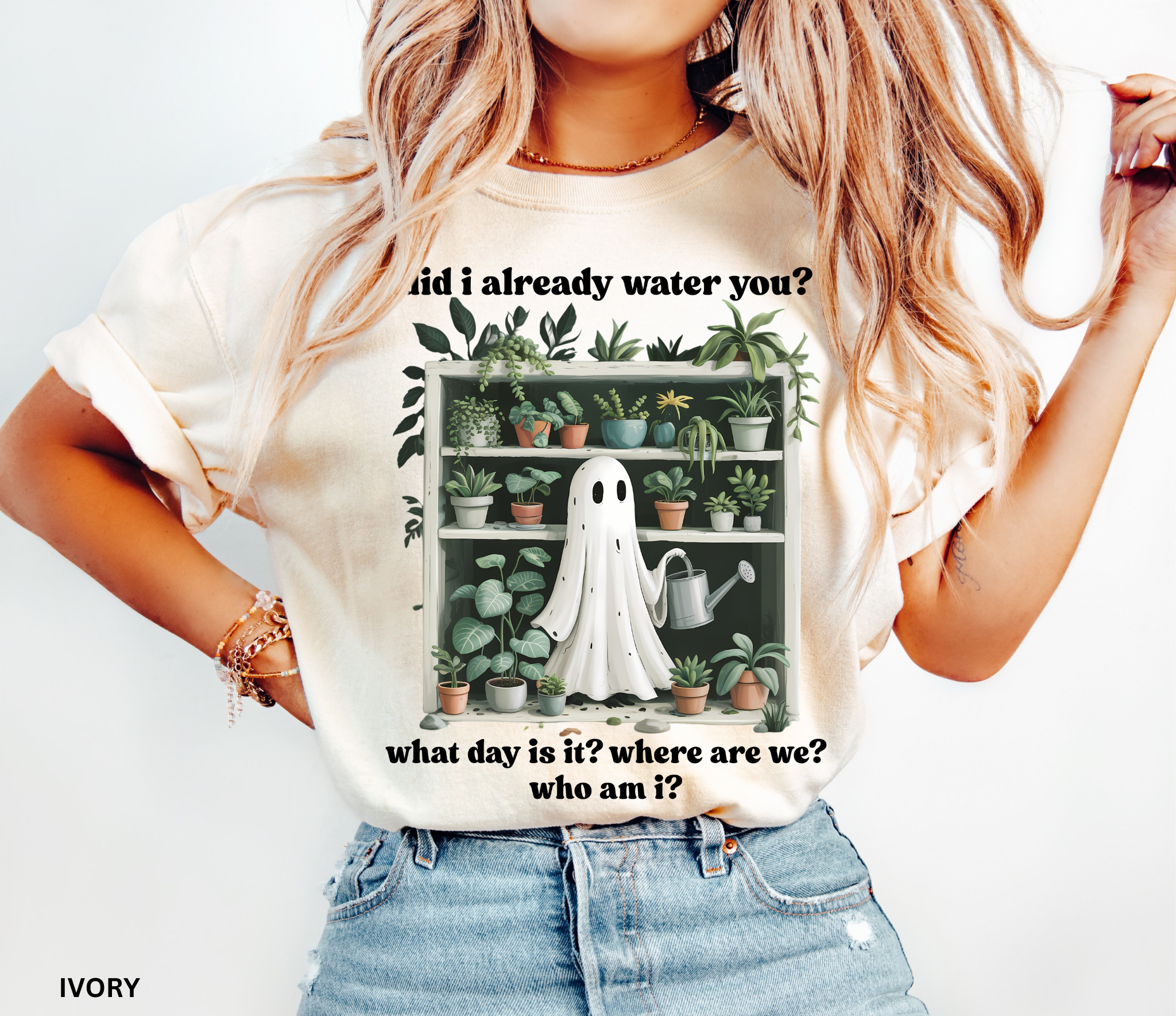 Funny gardening shirt featuring a ghost holding a watering can in front of a shelf full of houseplants with the phrase “Did I already water you? What day is it? Where are we? Who am I?”