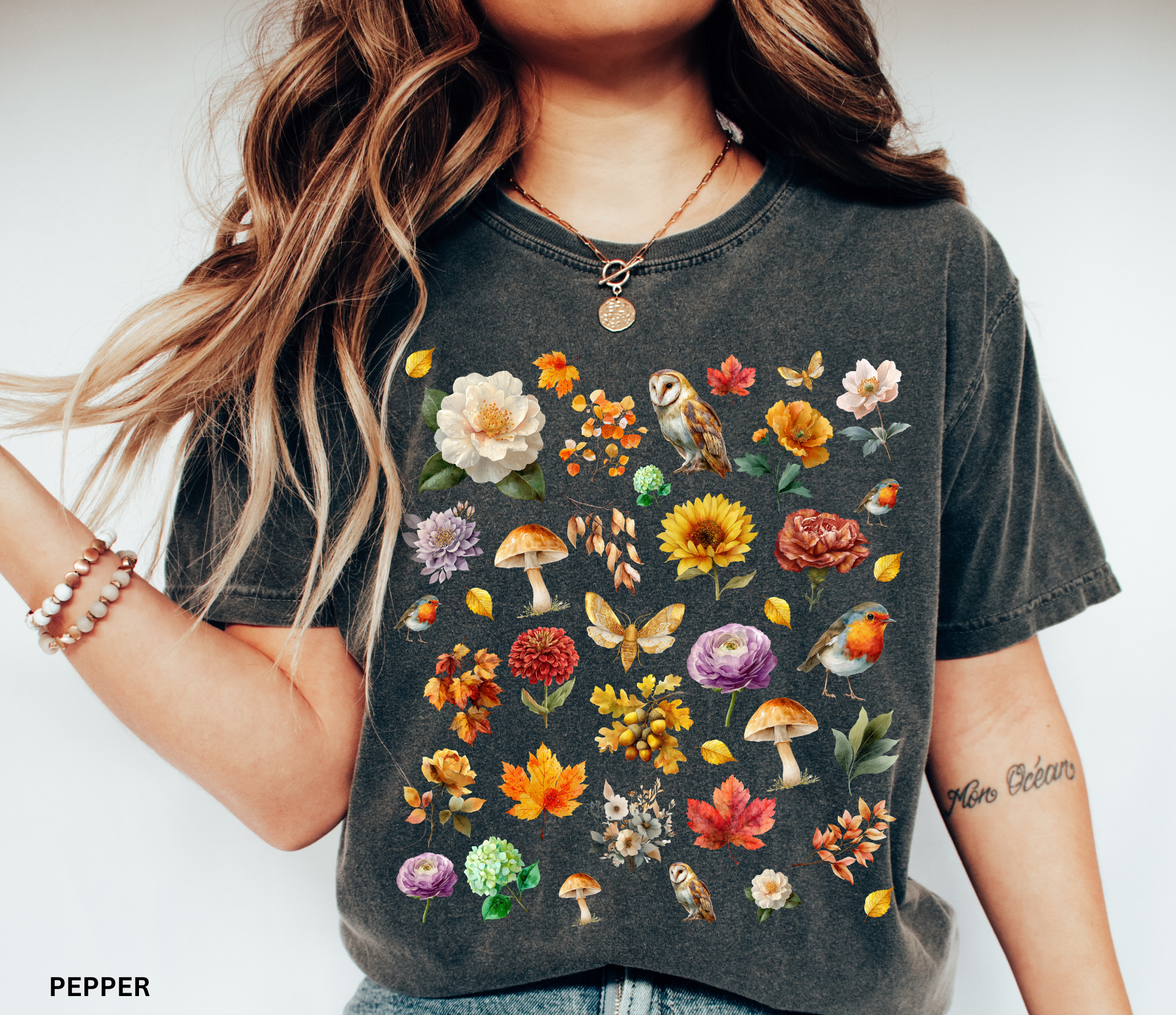Watercolor woodland collage design featuring owls, robins, mushrooms, butterflies, fall leaves, and florals on an autumn cottagecore shirt.