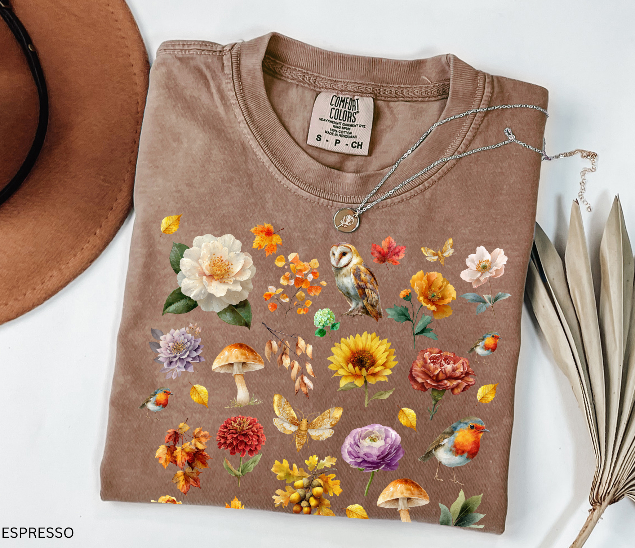 Watercolor woodland collage design featuring owls, robins, mushrooms, butterflies, fall leaves, and florals on an autumn cottagecore shirt.