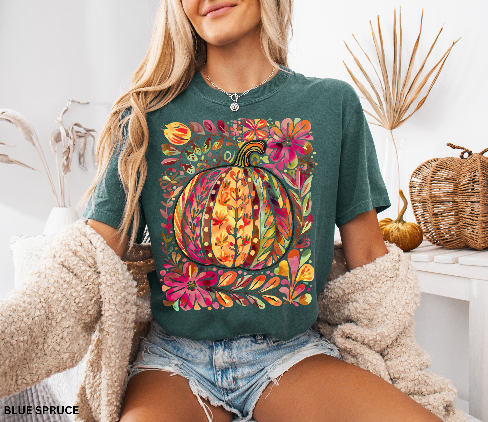 Watercolor collage of autumn leaves, butterflies, flowers, and birds in warm tones — cottagecore nature-inspired design on a cozy unisex shirt.