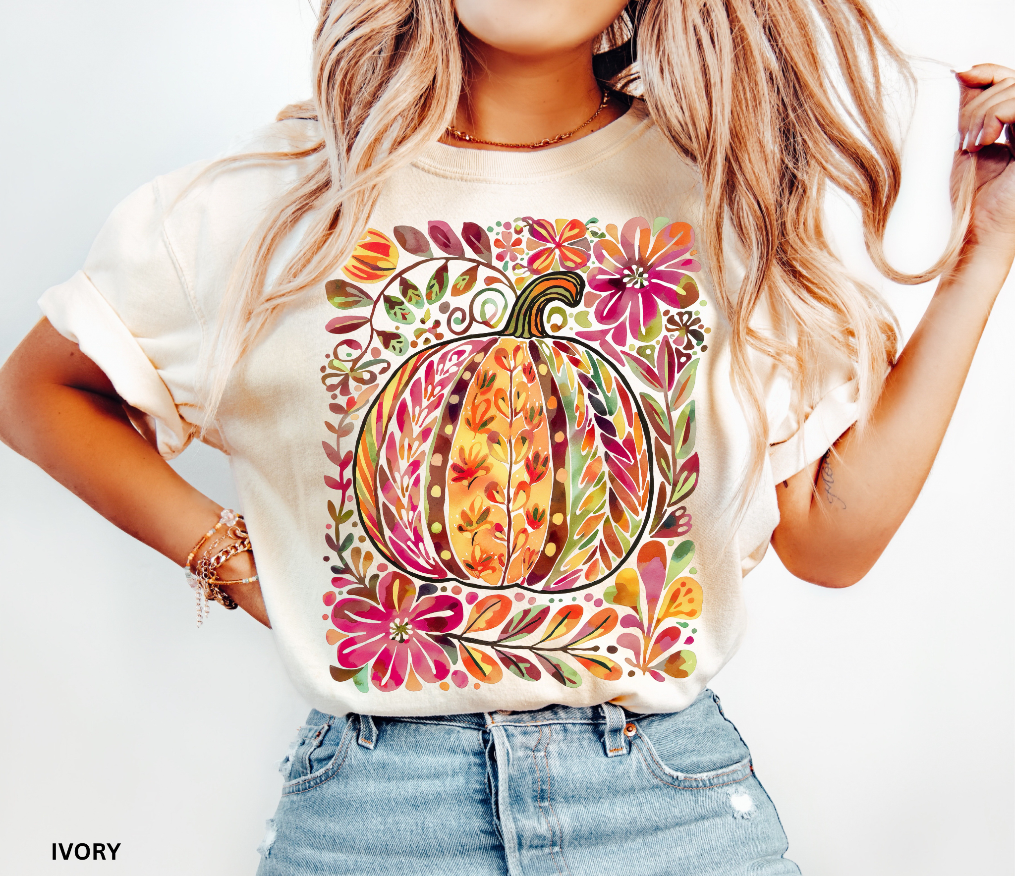 Watercolor collage of autumn leaves, butterflies, flowers, and birds in warm tones — cottagecore nature-inspired design on a cozy unisex shirt.