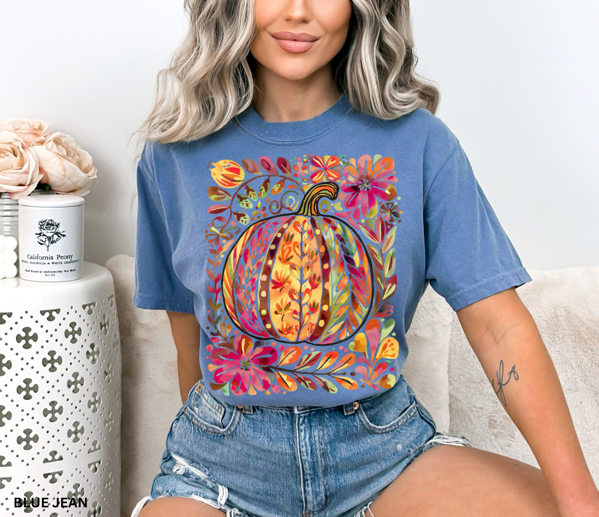 Watercolor collage of autumn leaves, butterflies, flowers, and birds in warm tones — cottagecore nature-inspired design on a cozy unisex shirt.