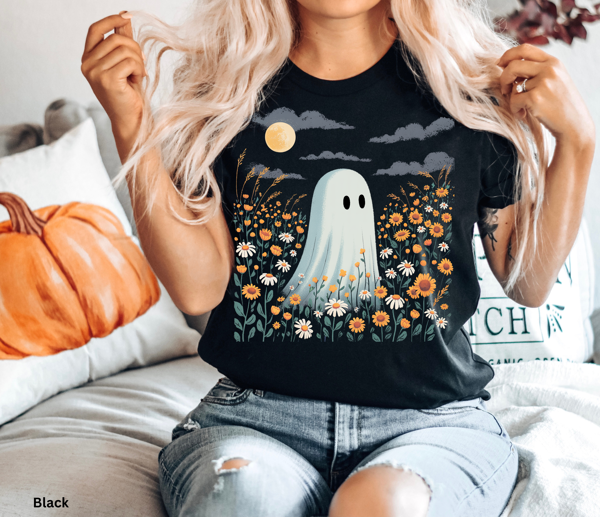 Cute ghost standing in a wildflower field under a full moon, cottagecore Halloween aesthetic t-shirt design
