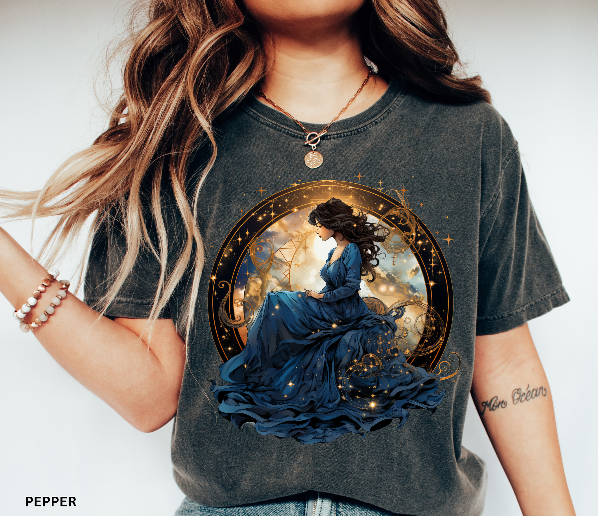 Celestial goddess in blue surrounded by gold constellations – witchcore shirt design