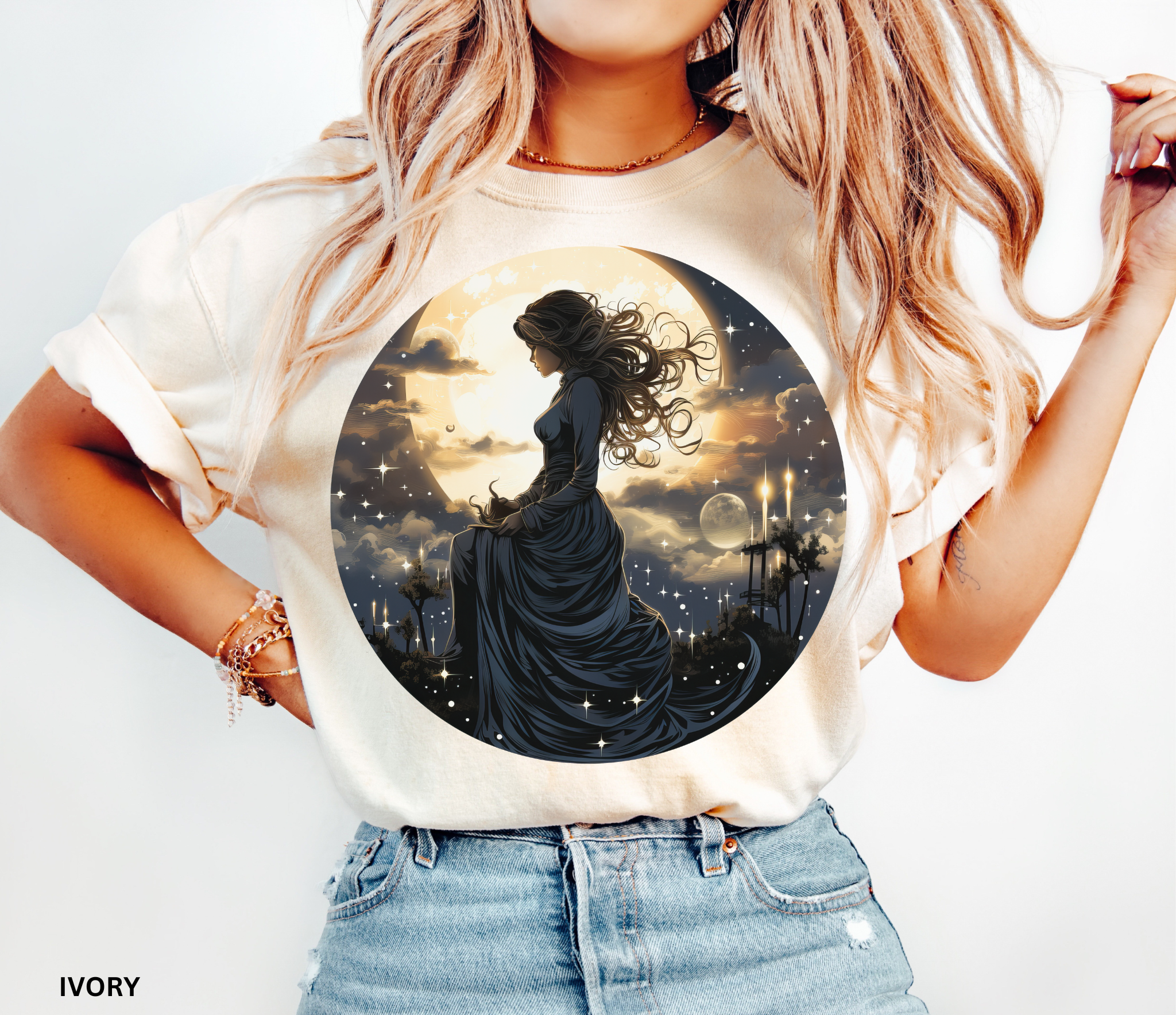 Celestial witch holding crescent moon beneath glowing sky – witchcore fantasy shirt design