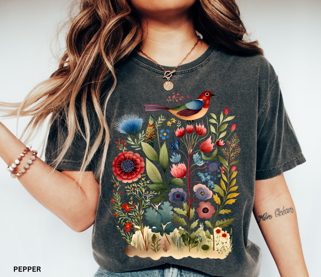 Cottagecore floral t-shirt featuring colorful bird and wildflowers — vintage botanical nature design on Comfort Colors fabric.