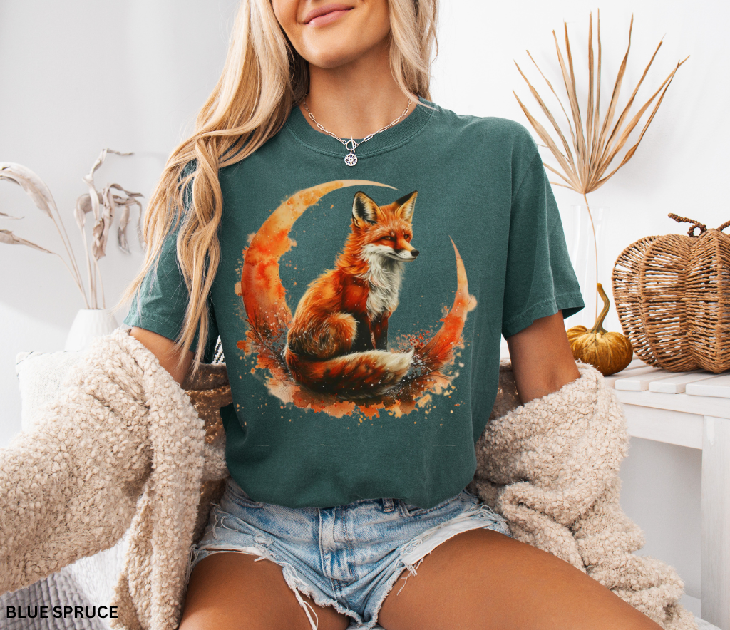 Watercolor fox sitting on crescent moon — whimsigoth forestcore design printed on Comfort Colors shirt for cottagecore aesthetic lovers.