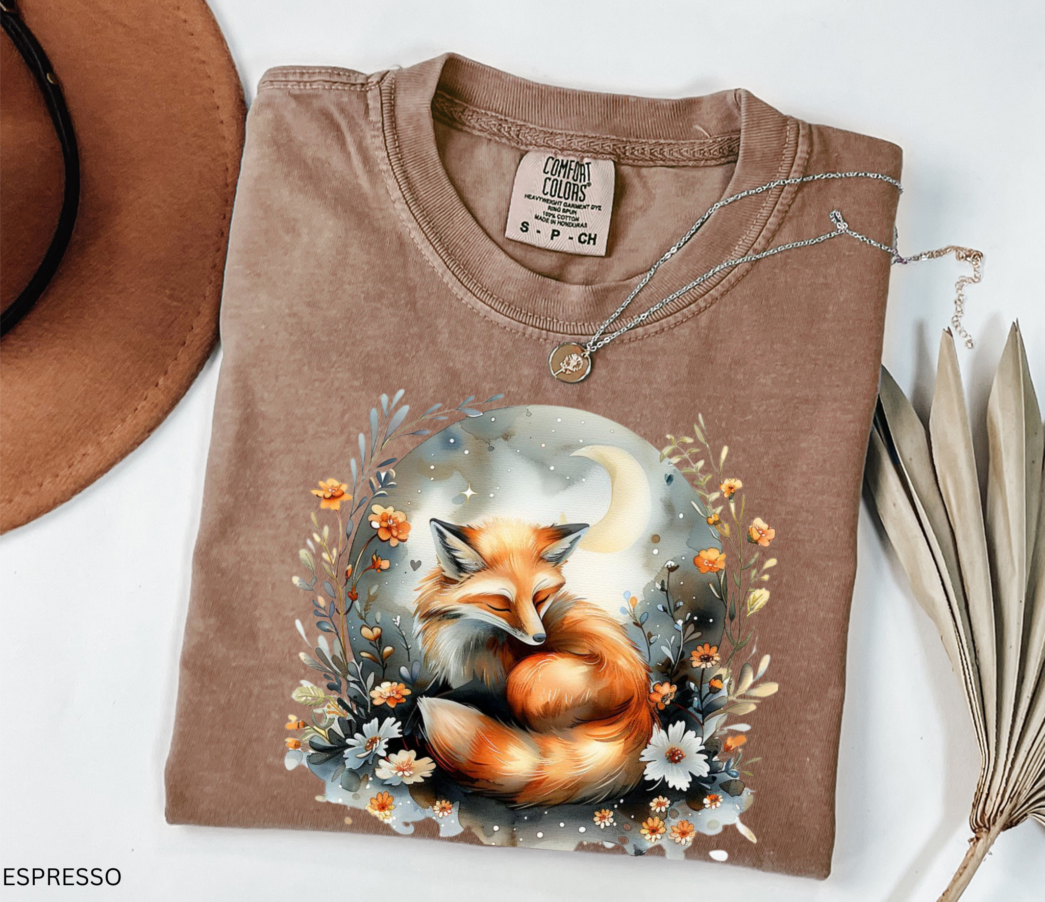 Sleeping fox surrounded by flowers and a crescent moon — cozy cottagecore forestcore design on soft Comfort Colors shirt.