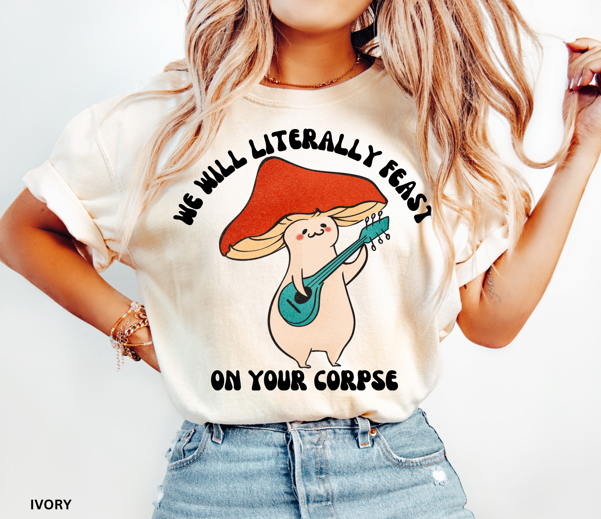 Cute cartoon mushroom playing guitar under a red cap with the quote “We Will Literally Feast on Your Corpse,” printed on a Comfort Colors tee.