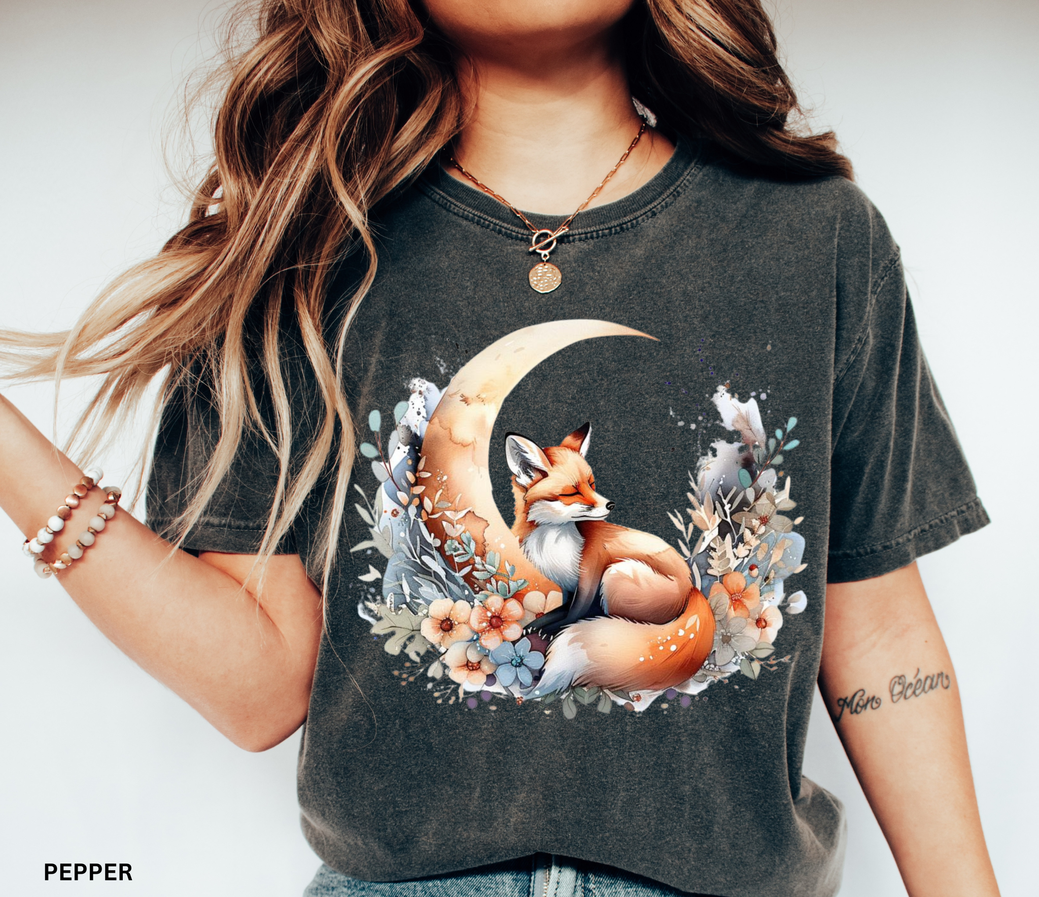 Cottagecore design of a fox sleeping beneath a crescent moon surrounded by pastel flowers and forest leaves.