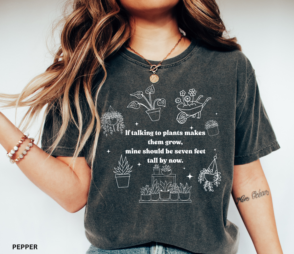 Funny plant lover shirt design with white line-art plants and text “If talking to plants makes them grow, mine should be seven feet tall by now.”
