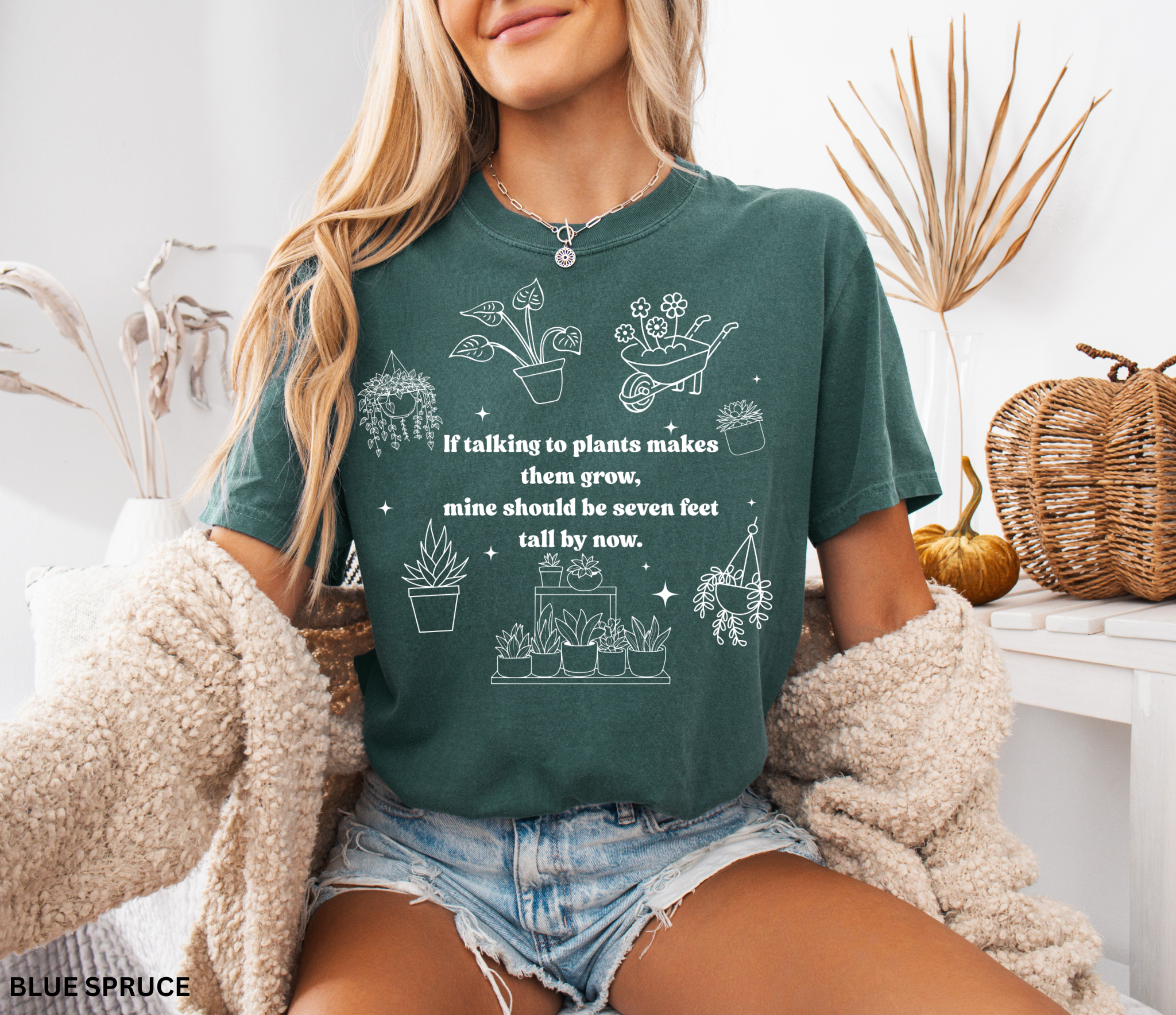 Funny plant lover shirt design with white line-art plants and text “If talking to plants makes them grow, mine should be seven feet tall by now.”
