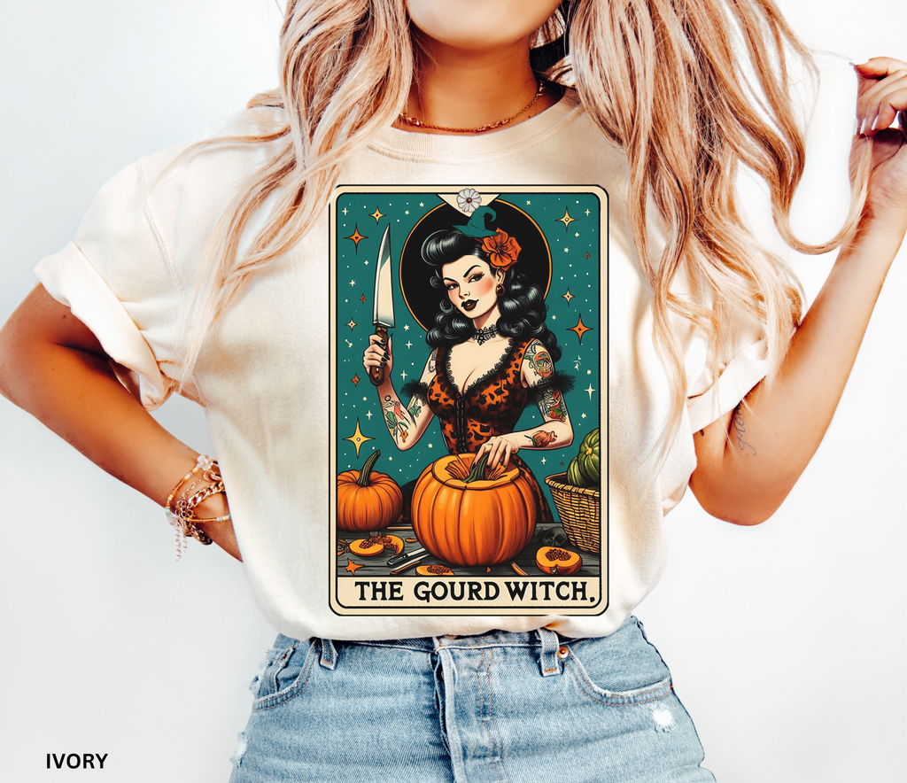 Vintage pin-up witch carving pumpkins under stars in a tarot-style design titled “The Gourd Witch.”