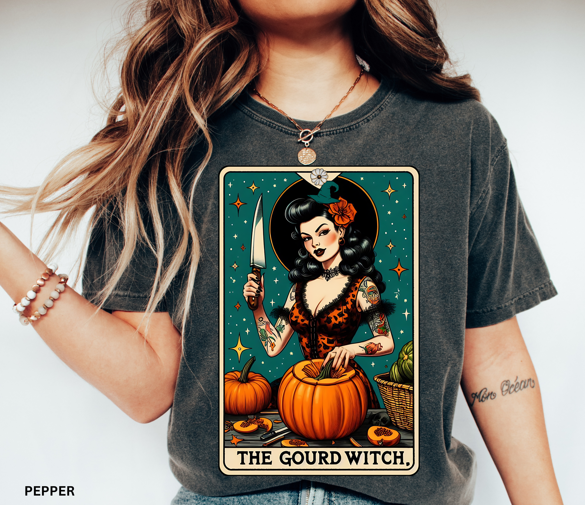 Vintage pin-up witch carving pumpkins under stars in a tarot-style design titled “The Gourd Witch.”