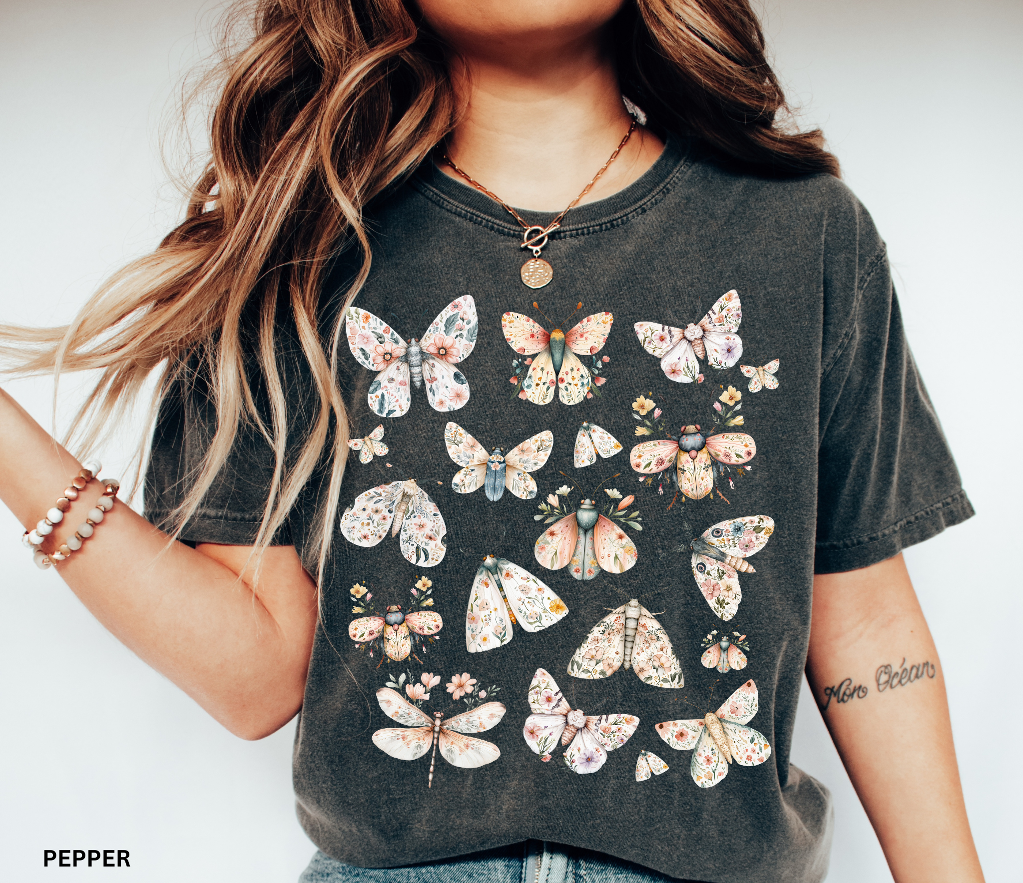 Cottagecore floral moth and butterfly shirt design with pastel flowers on delicate wings.