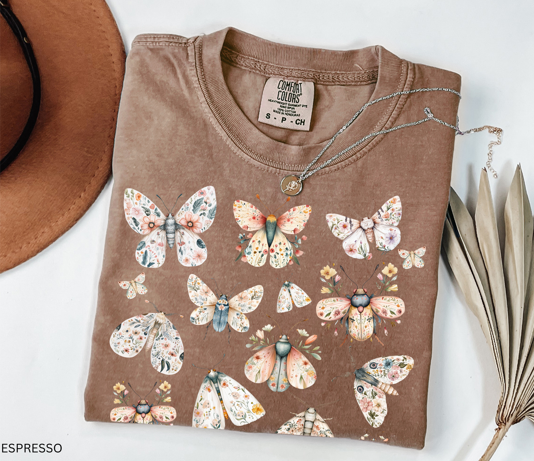Cottagecore floral moth and butterfly shirt design with pastel flowers on delicate wings.