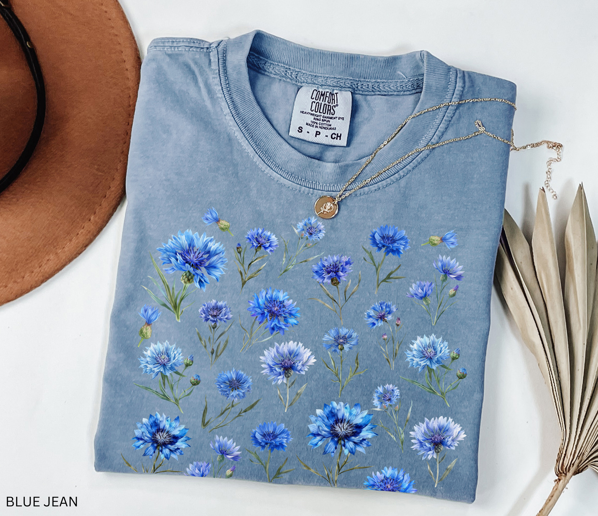 Hand-drawn blue cornflower floral shirt design, Nordic meadow aesthetic with delicate botanical blooms.
