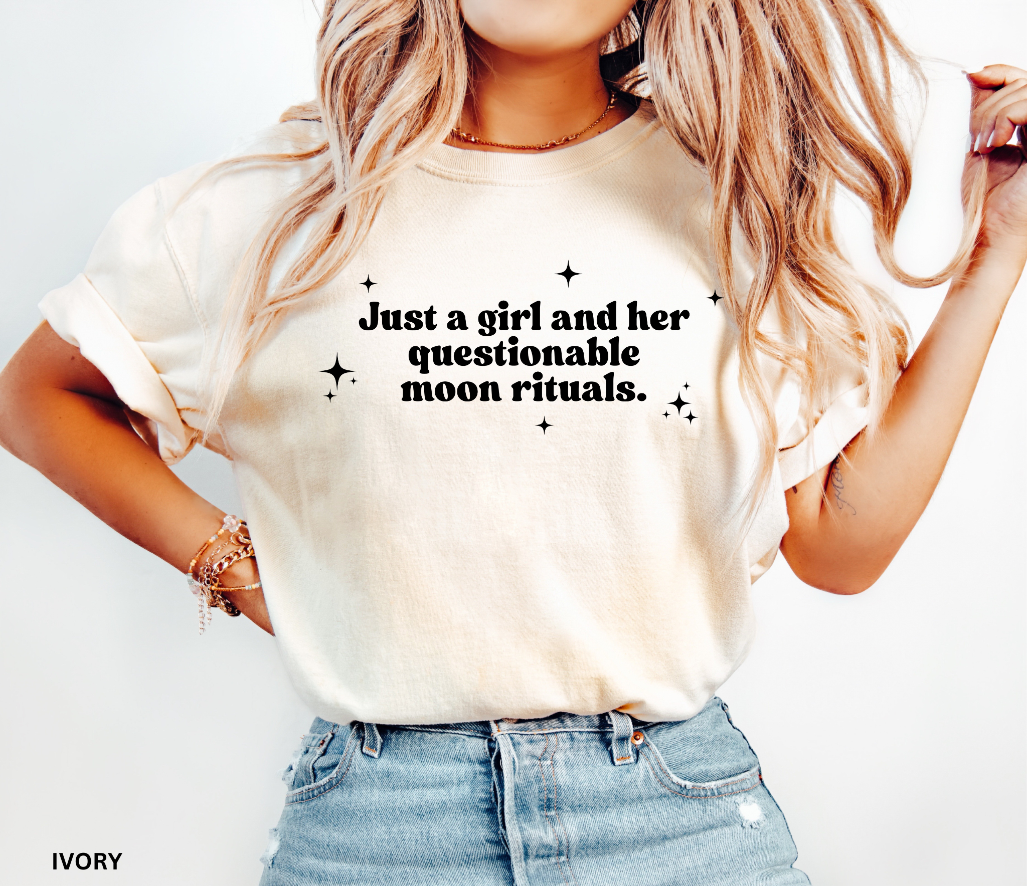 Funny witchy shirt design reading “Just a girl and her questionable moon rituals” with sparkly stars around the text.