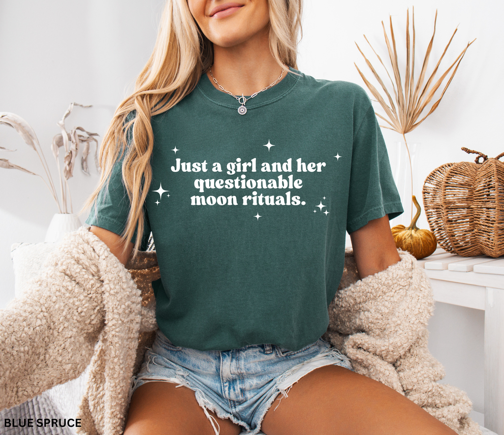 Funny witchy shirt design reading “Just a girl and her questionable moon rituals” with sparkly stars around the text.