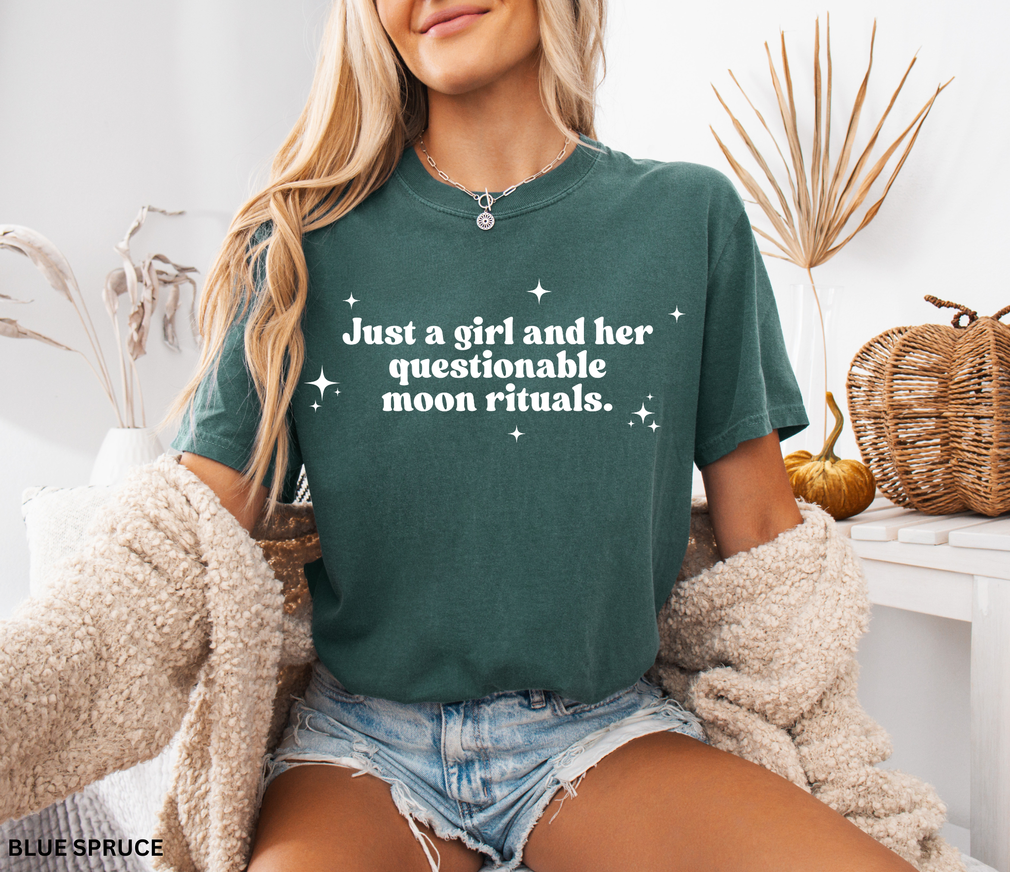 Funny witchy shirt design reading “Just a girl and her questionable moon rituals” with sparkly stars around the text.