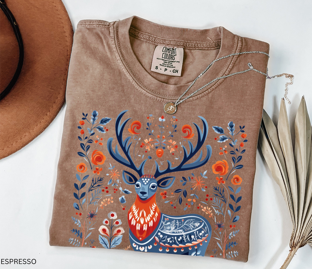 Scandinavian folk art deer shirt design with blue and orange Nordic floral patterns surrounding a majestic stag.