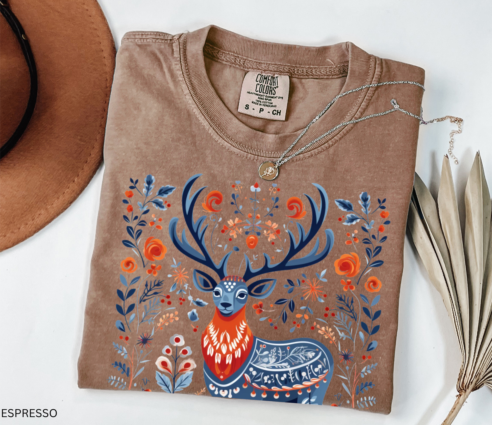 Scandinavian folk art deer shirt design with blue and orange Nordic floral patterns surrounding a majestic stag.